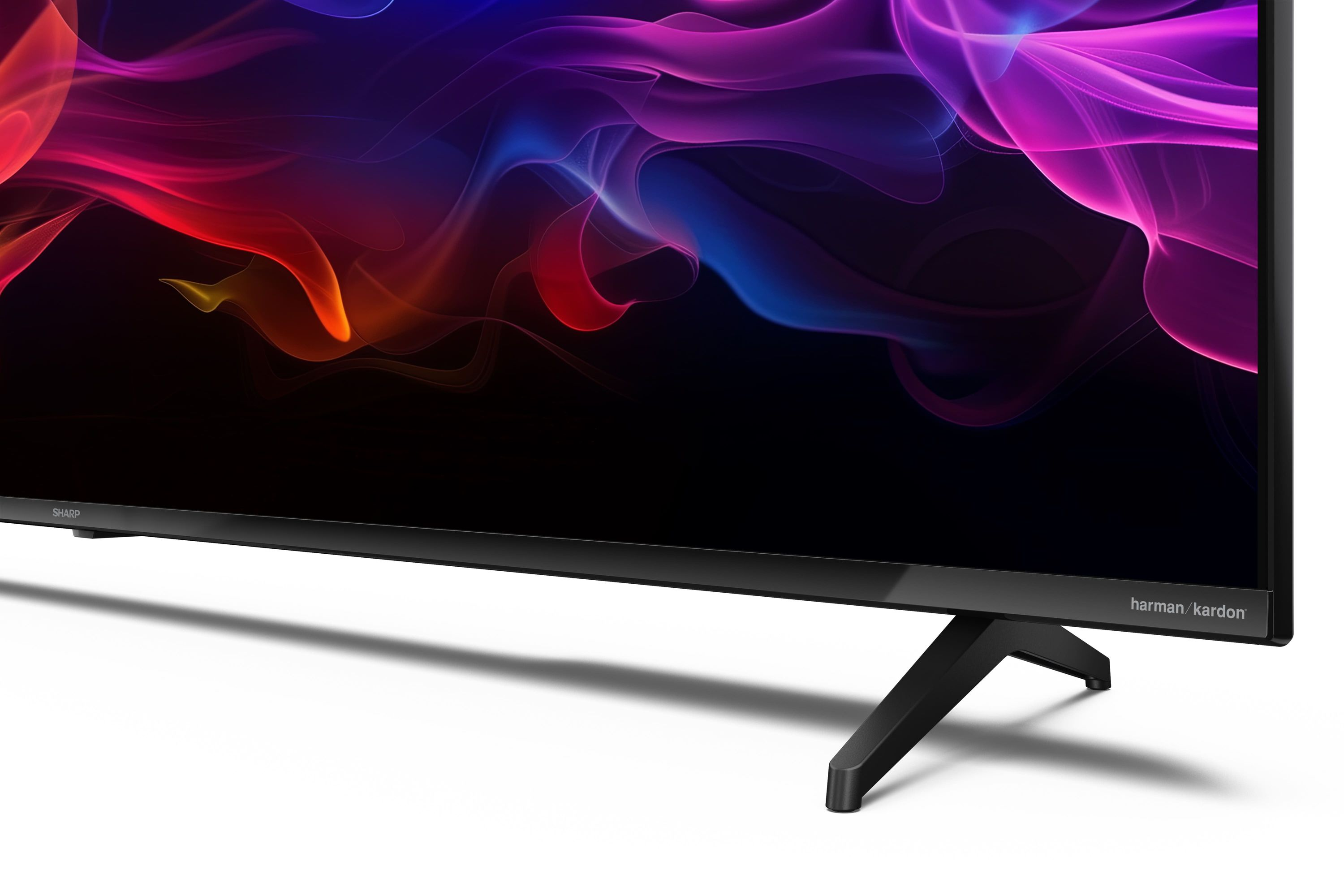 Un téléviseur affichant de la fumée abstraite et colorée à l'écran avec un pied noir.