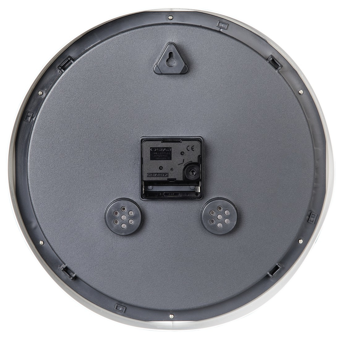 Tył okrągłego zegara z mechanizmem kwarcowym i hakiem.