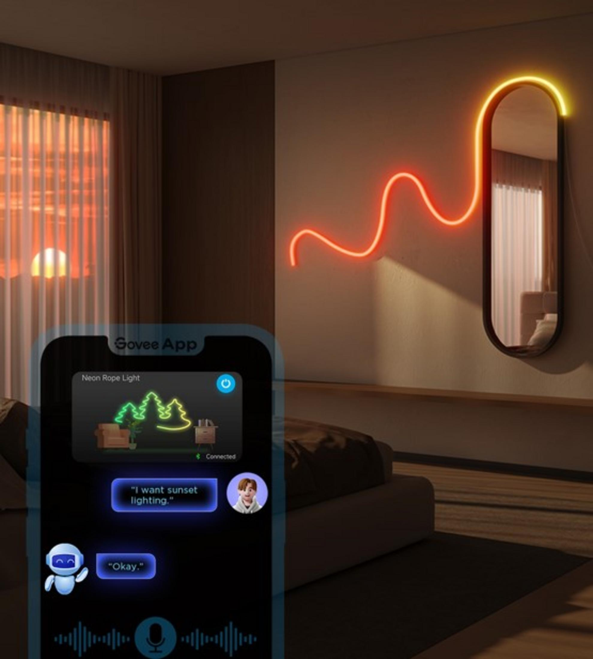 Uno smartphone mostra un'app con una luce al neon. Si vede un tramonto.