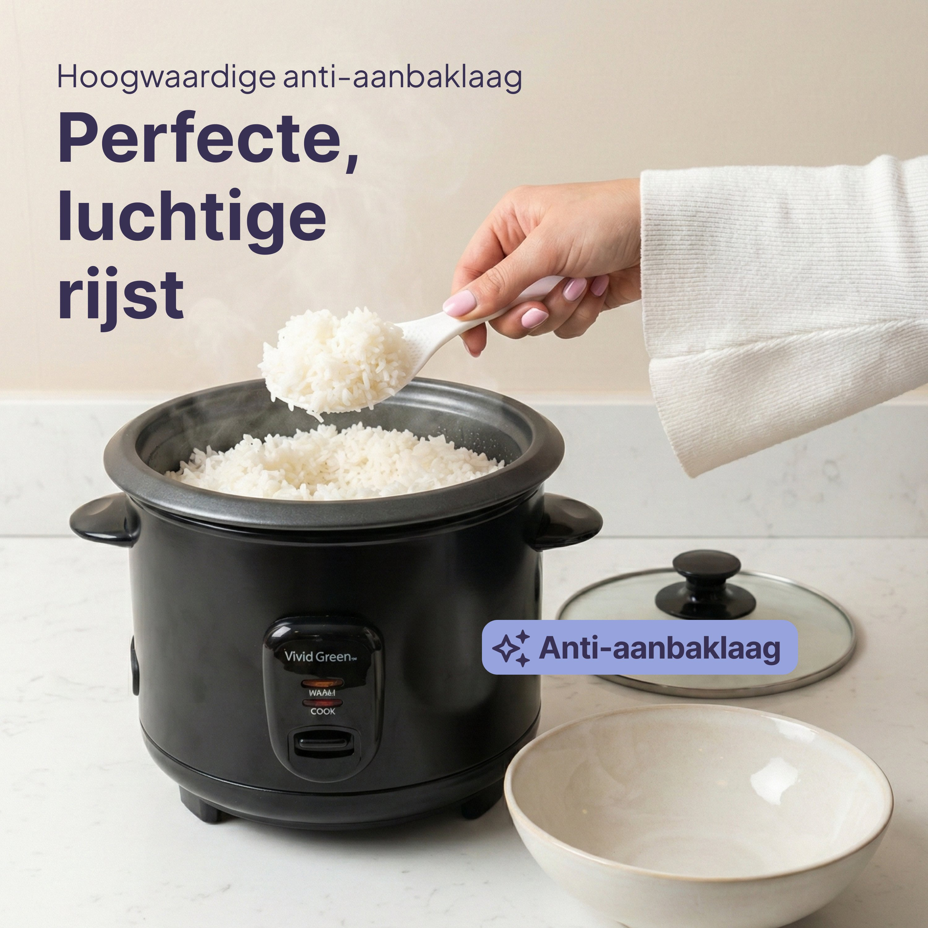 A person scoops rice from a black rice cooker with a rice spoon.