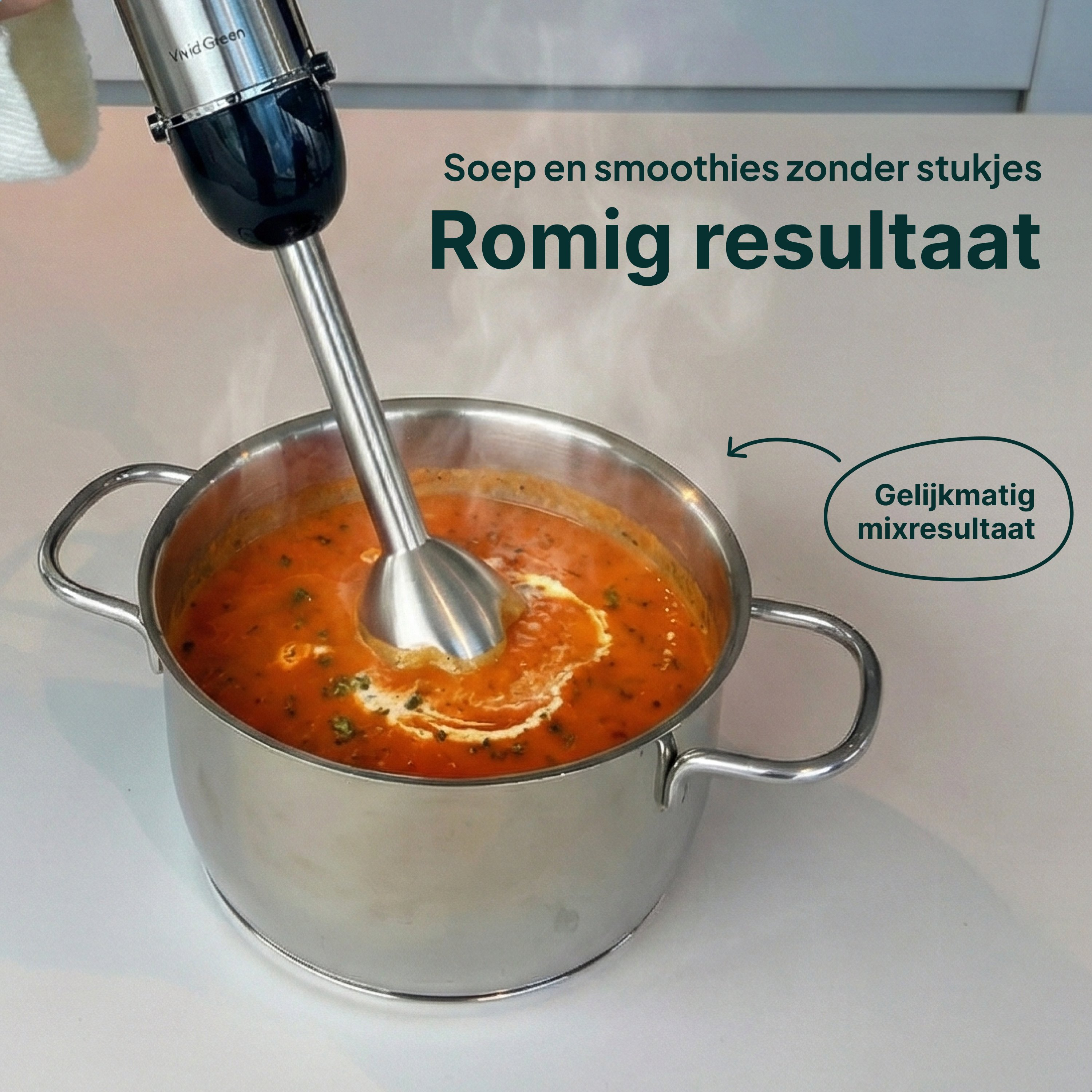 An immersion blender mixes orange soup in a pot with a creamy swirl.