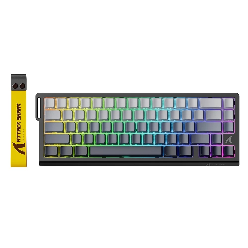 Gökkuşağı RGB aydınlatmalı siyah klavye ve sarı bileklik.