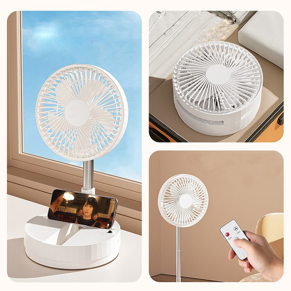 Un ventilador blanco con soporte para móvil y mando.