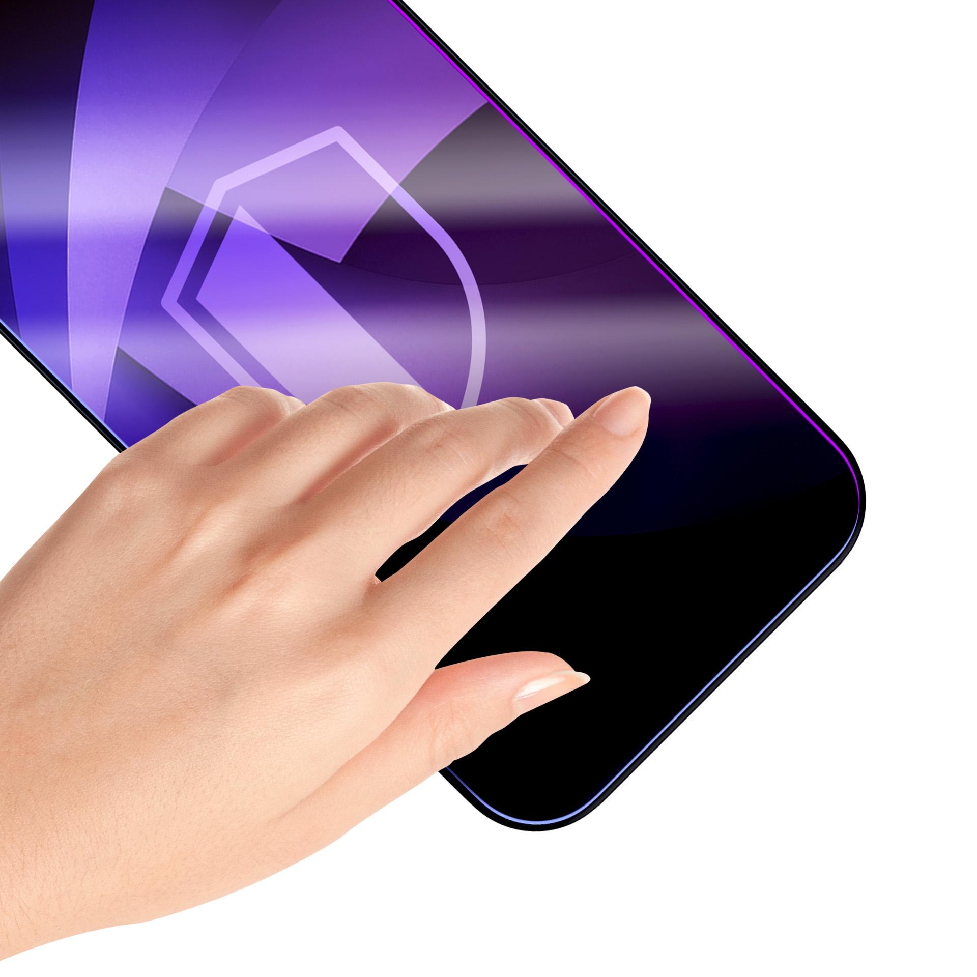 Dłoń dotyka ekranu ciemnego telefonu z fioletową tarczą wzorzystą.