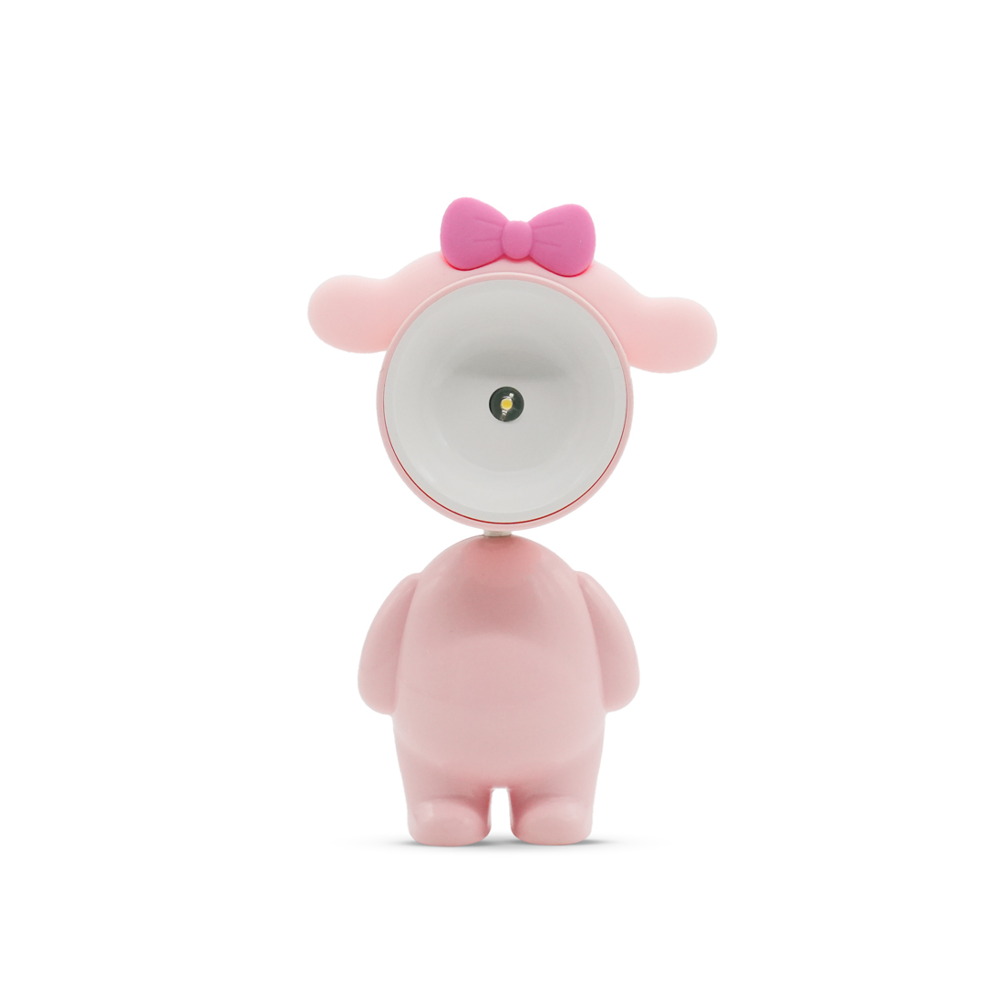 Una lampada rosa a forma di orso con un fiocco in testa.