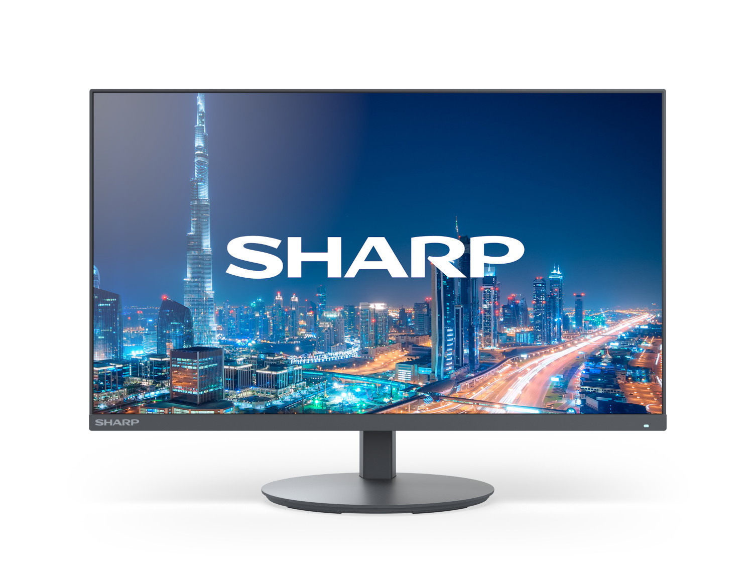 Un monitor moderno mostra un paesaggio urbano notturno con il Burj Khalifa e il logo SHARP.