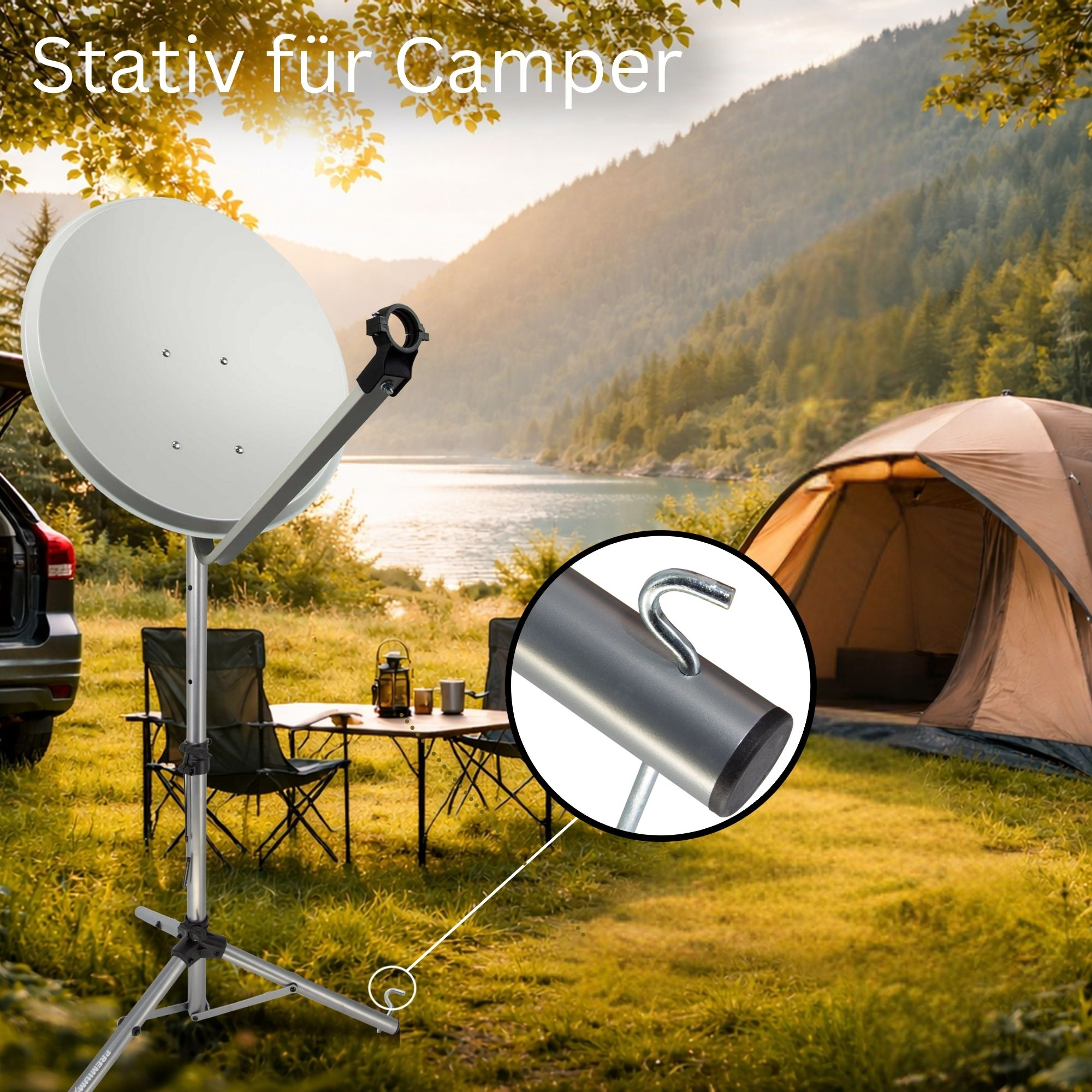 Satellitenschüssel auf Stativ mit Campingplatz, See und Bergen im Hintergrund.