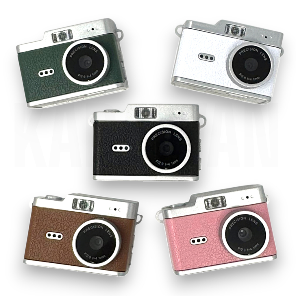Cinco cámaras retro coloridas: verde, blanca, negra, marrón y rosa.