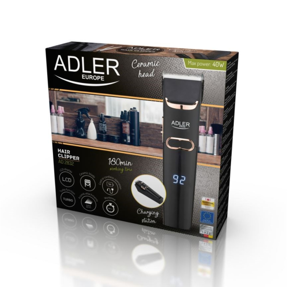 Scatola di un tagliacapelli Adler nero con testina in ceramica e display LCD.