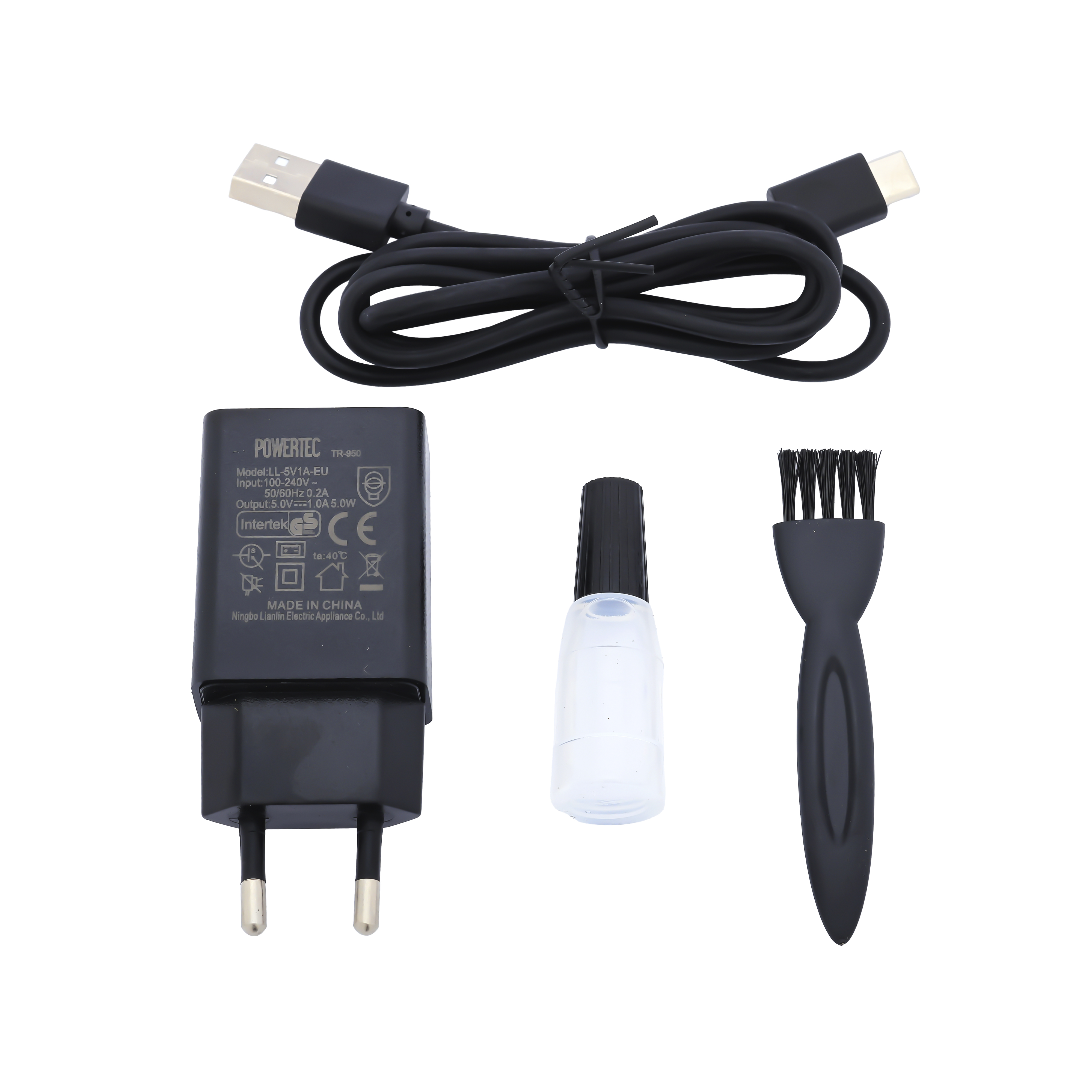 Siyah güç adaptörü, USB kablosu, küçük şişe ve fırça beyaz arka planda.