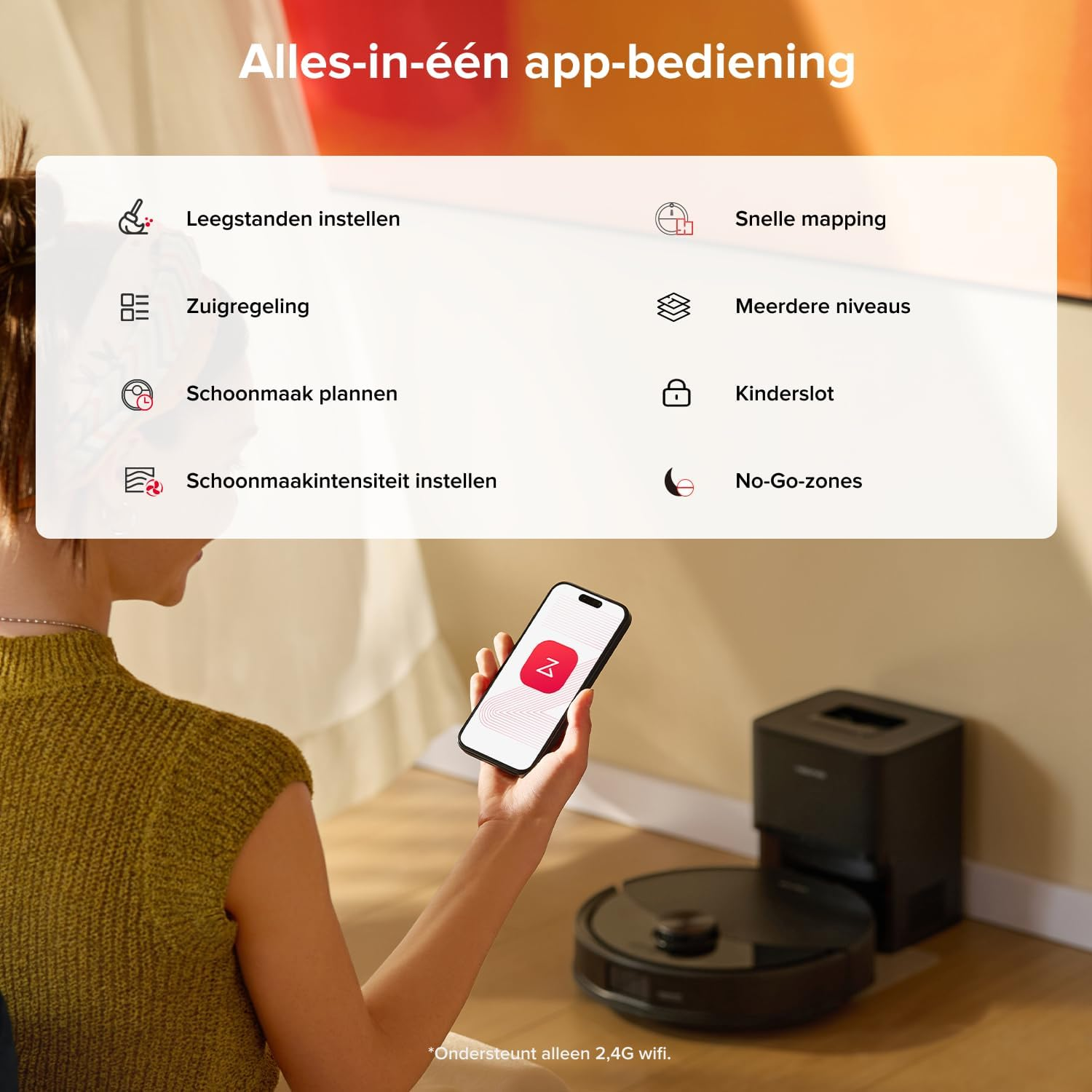 Un aspirateur robot avec station et menus d'application.