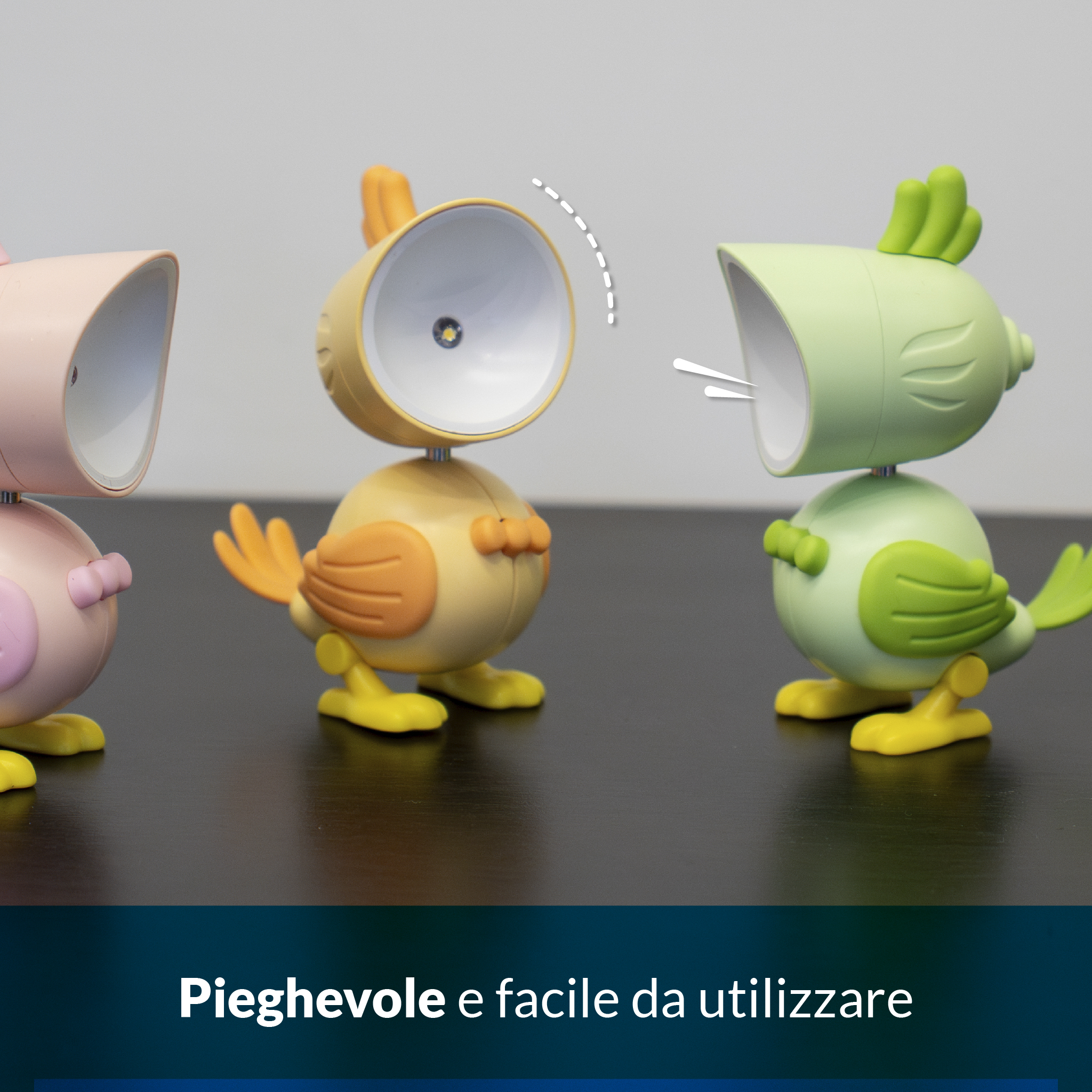 Tre simpatiche lampade da notte a forma di uccello, rosa, gialla e verde.