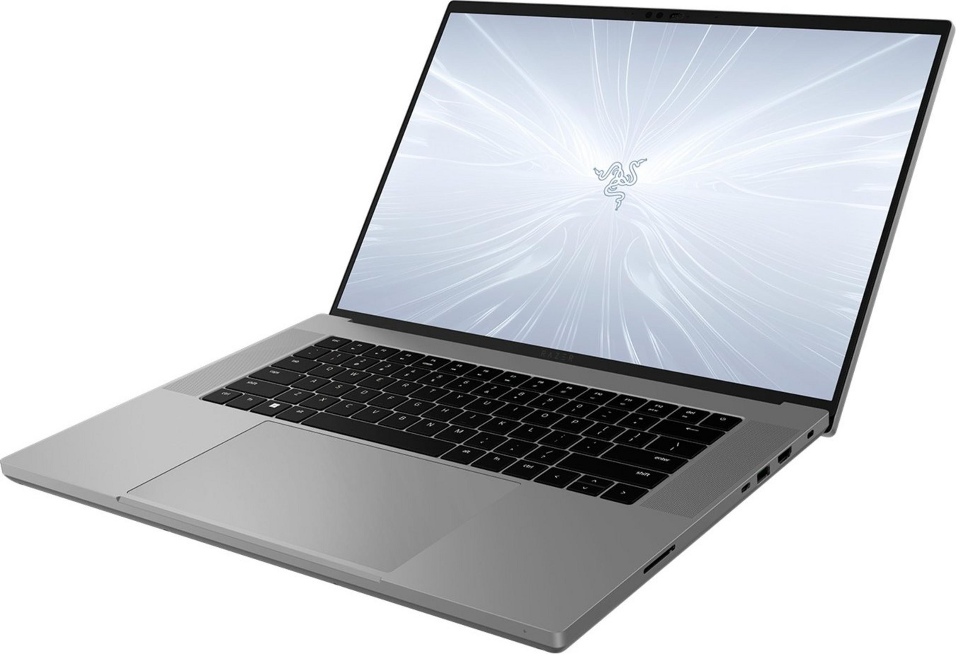 Srebrny laptop z podświetlaną klawiaturą i logo Razer na ekranie.