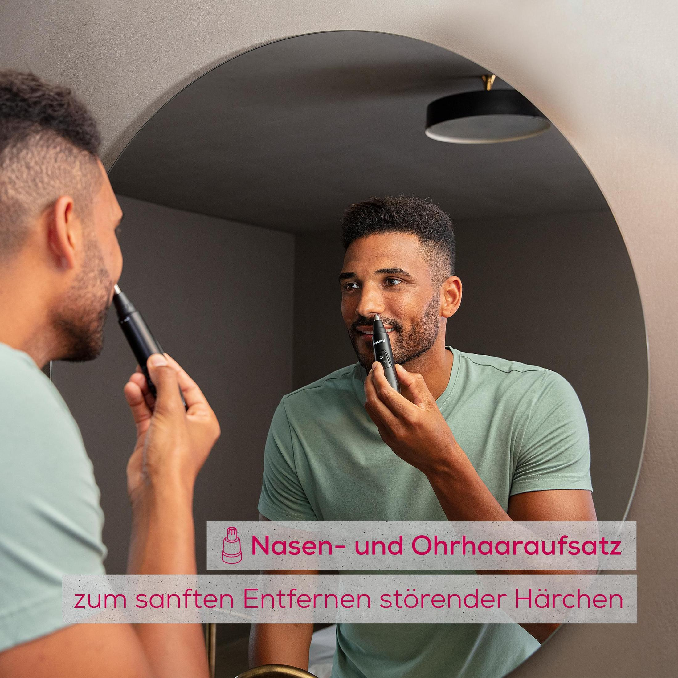 Man trimt neushaar met trimmer voor spiegel. Tekst: Neus- en oorhaartrimmeropzetstuk.