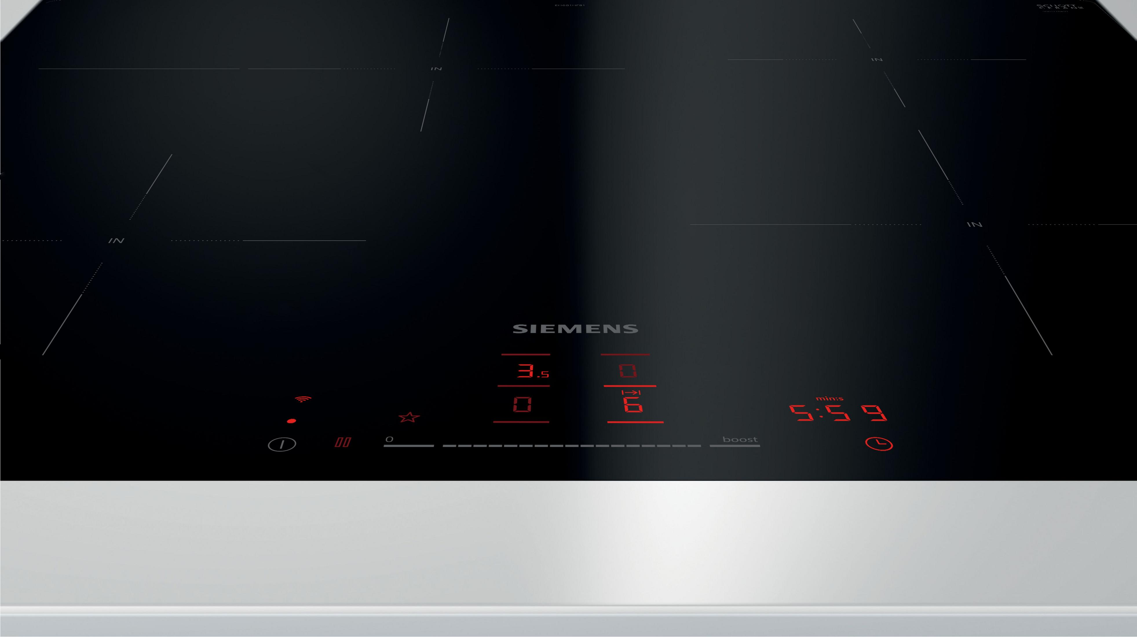 Une plaque à induction Siemens avec écran numérique rouge et marquages de zone de cuisson.
