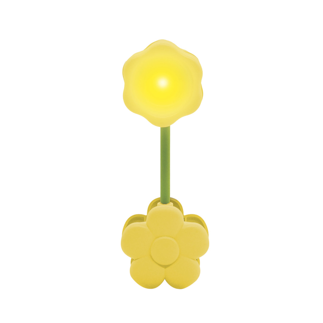 Un fiore giallo brillante con stelo verde e clip a forma di fiore.