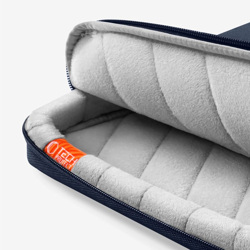 Dunkelblaue Laptoptasche mit weichem, gestepptem Innenfutter und orangefarbenem Logo.