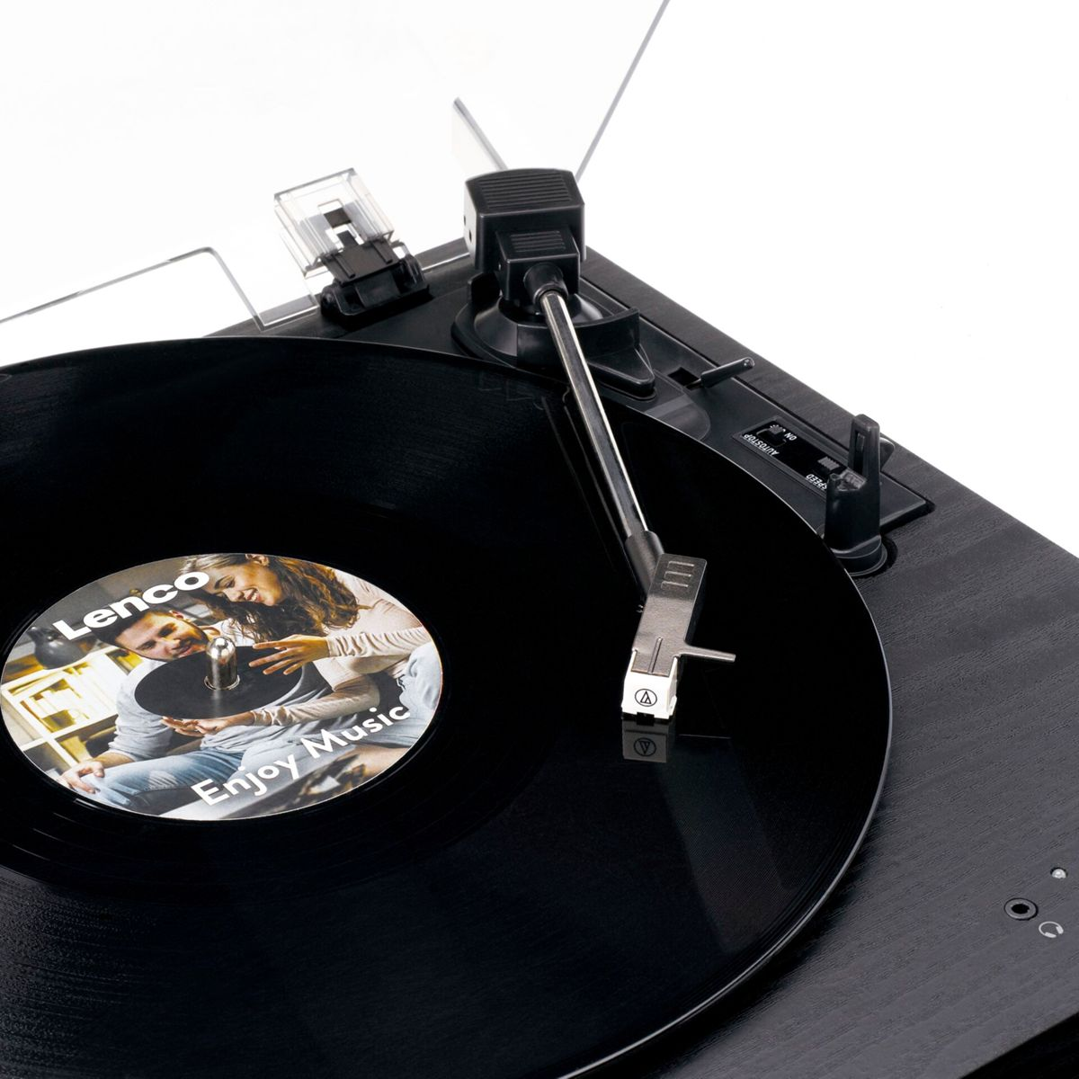 Black record player with a vinyl record playing and a couple pictured on it.