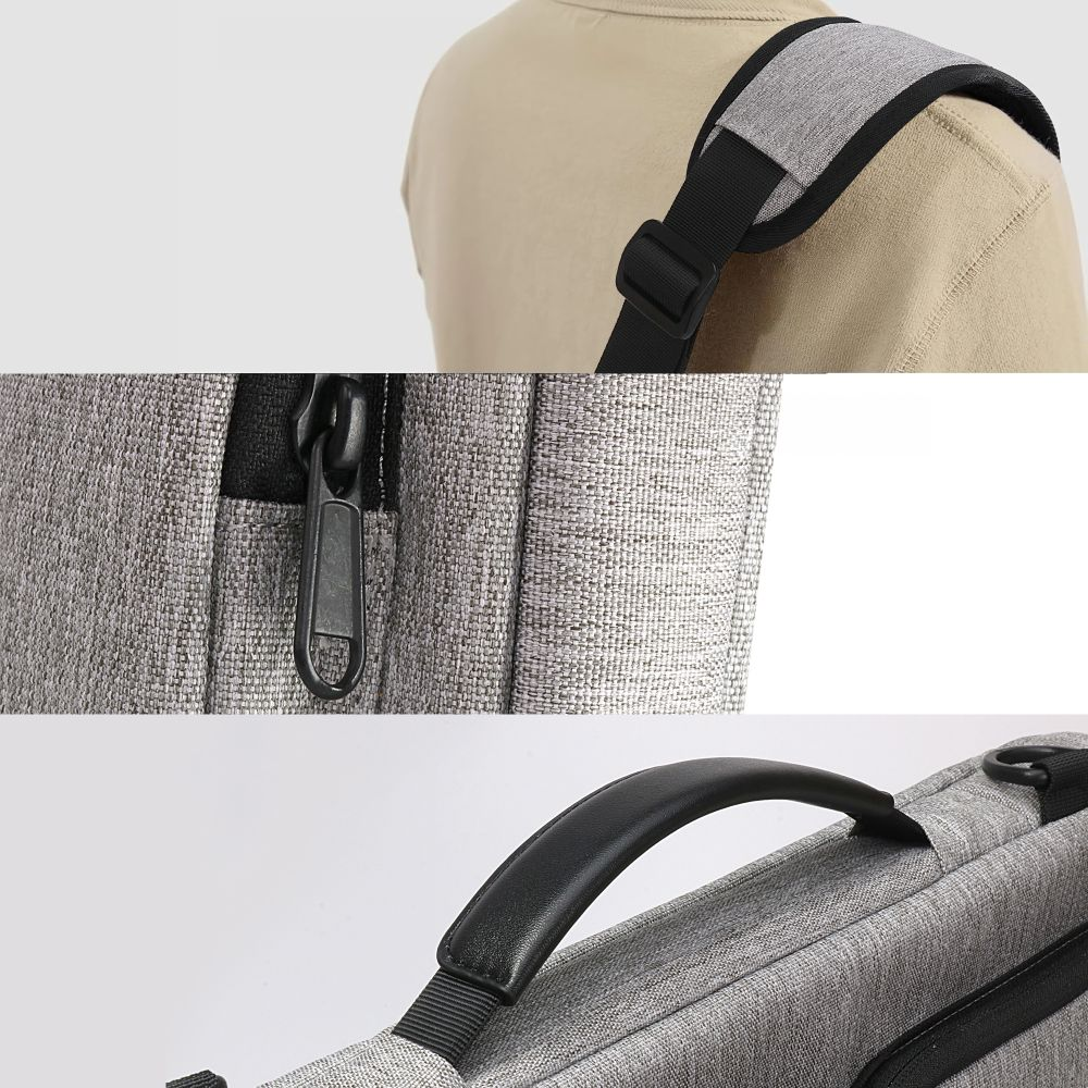 Graue Tasche mit Schultergurt, Reißverschluss und Griff.