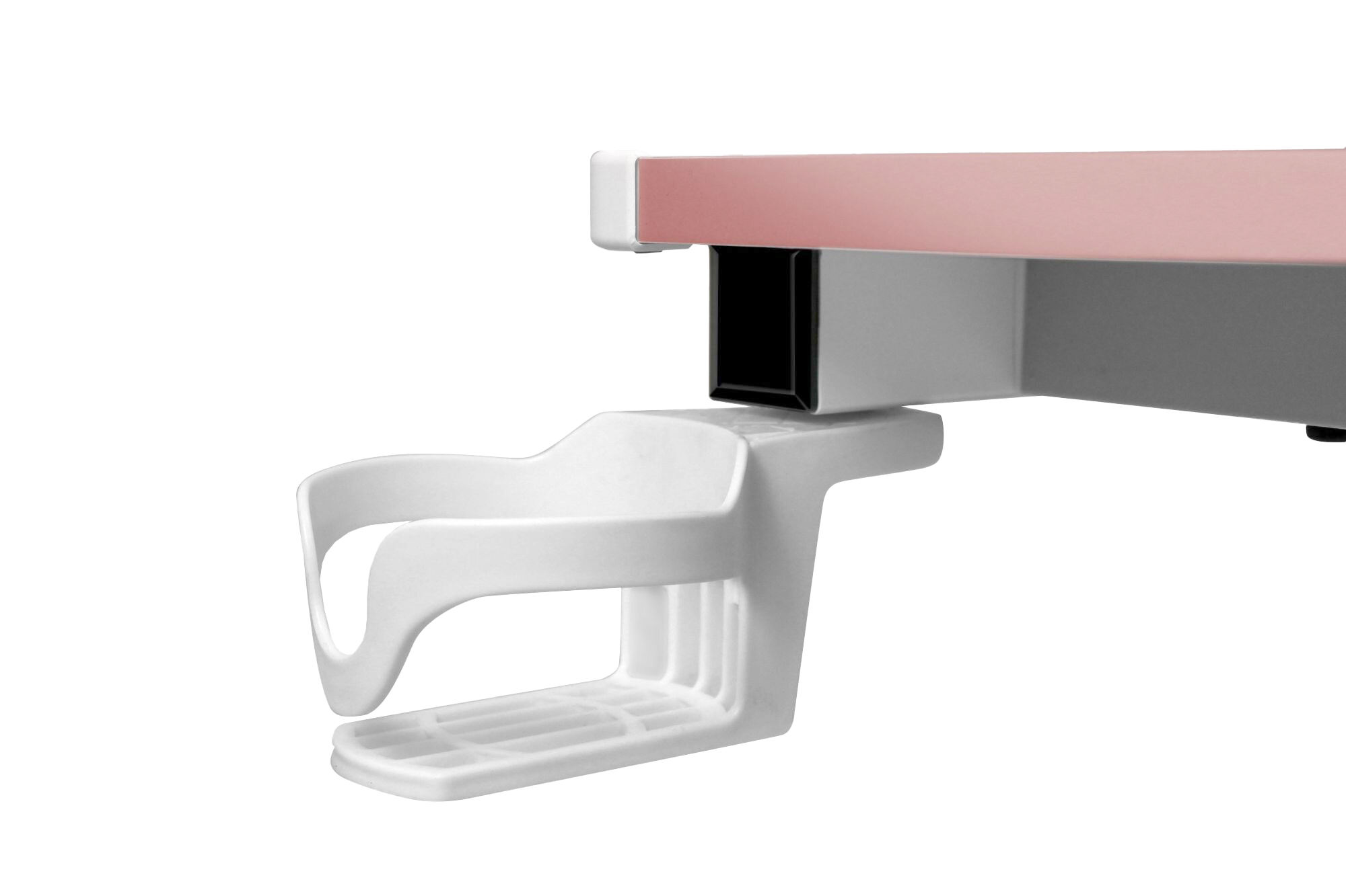 Biały uchwyt na kubek jest przymocowany do stołu z różową krawędzią.