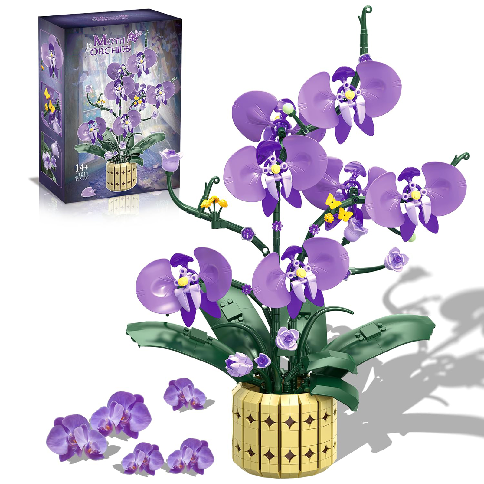 Lila Orchideen aus Bausteinen in einem goldfarbenen Topf, mit Kasten.