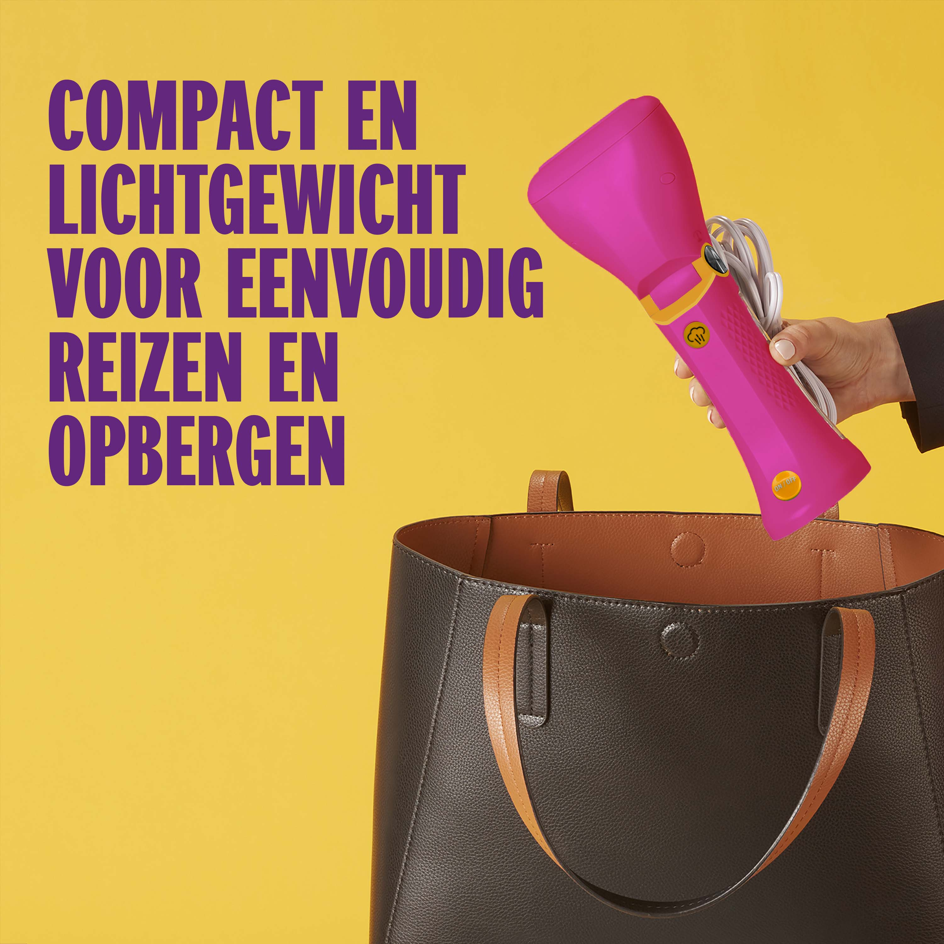 A hand holds a pink steamer over a brown tote bag.