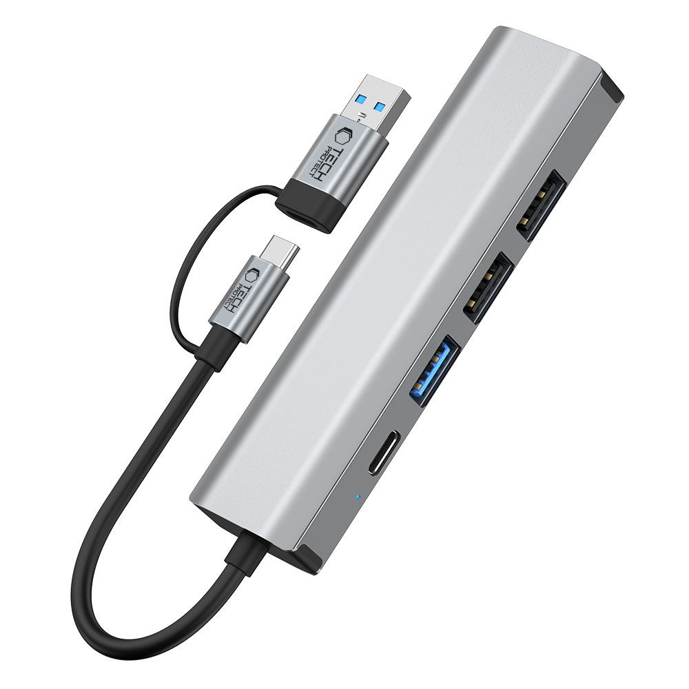 Hub USB-C argentato con più porte e due cavi USB-C e USB-A collegati.