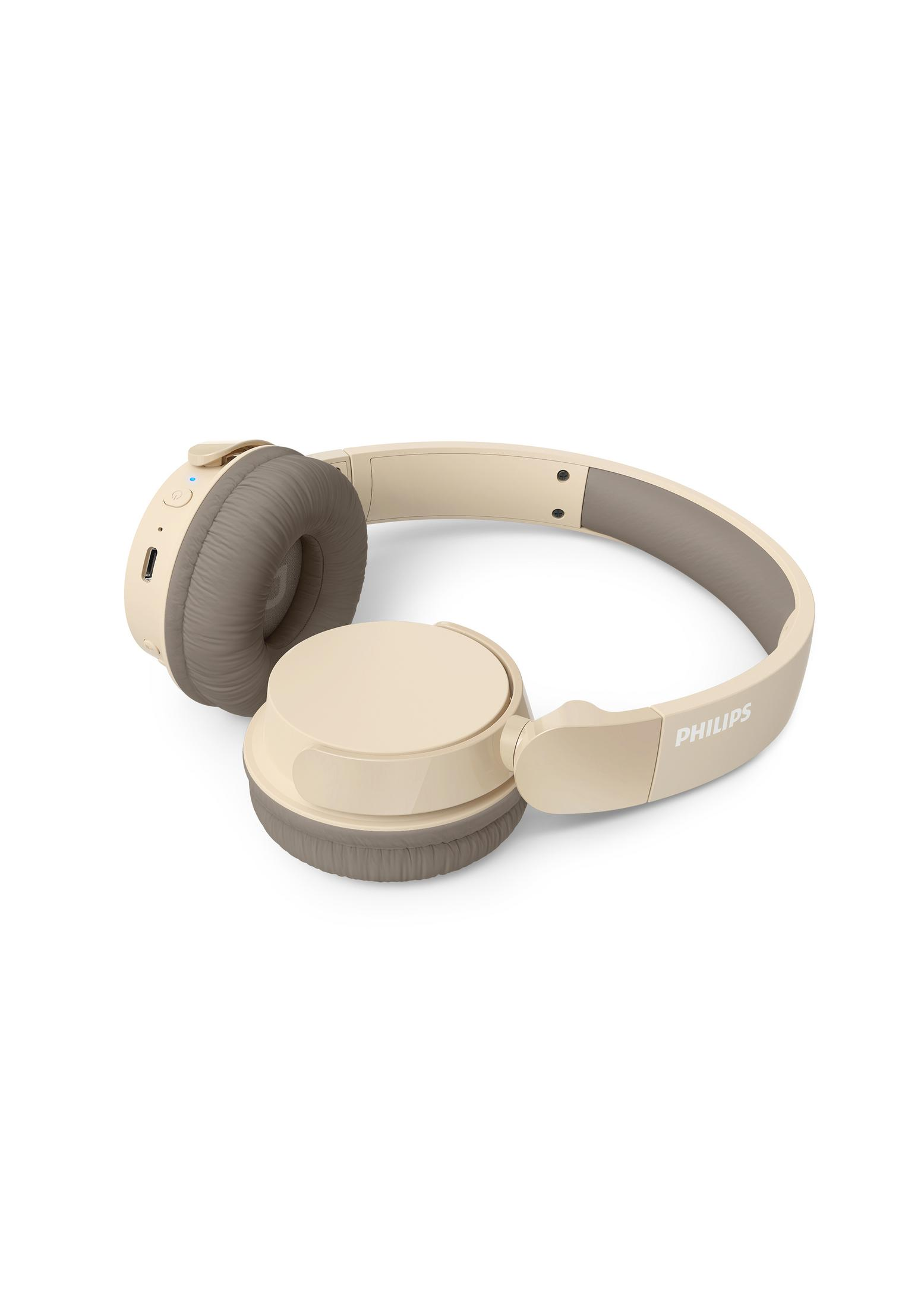 Auriculares Philips beige con almohadillas marrones sobre fondo blanco.