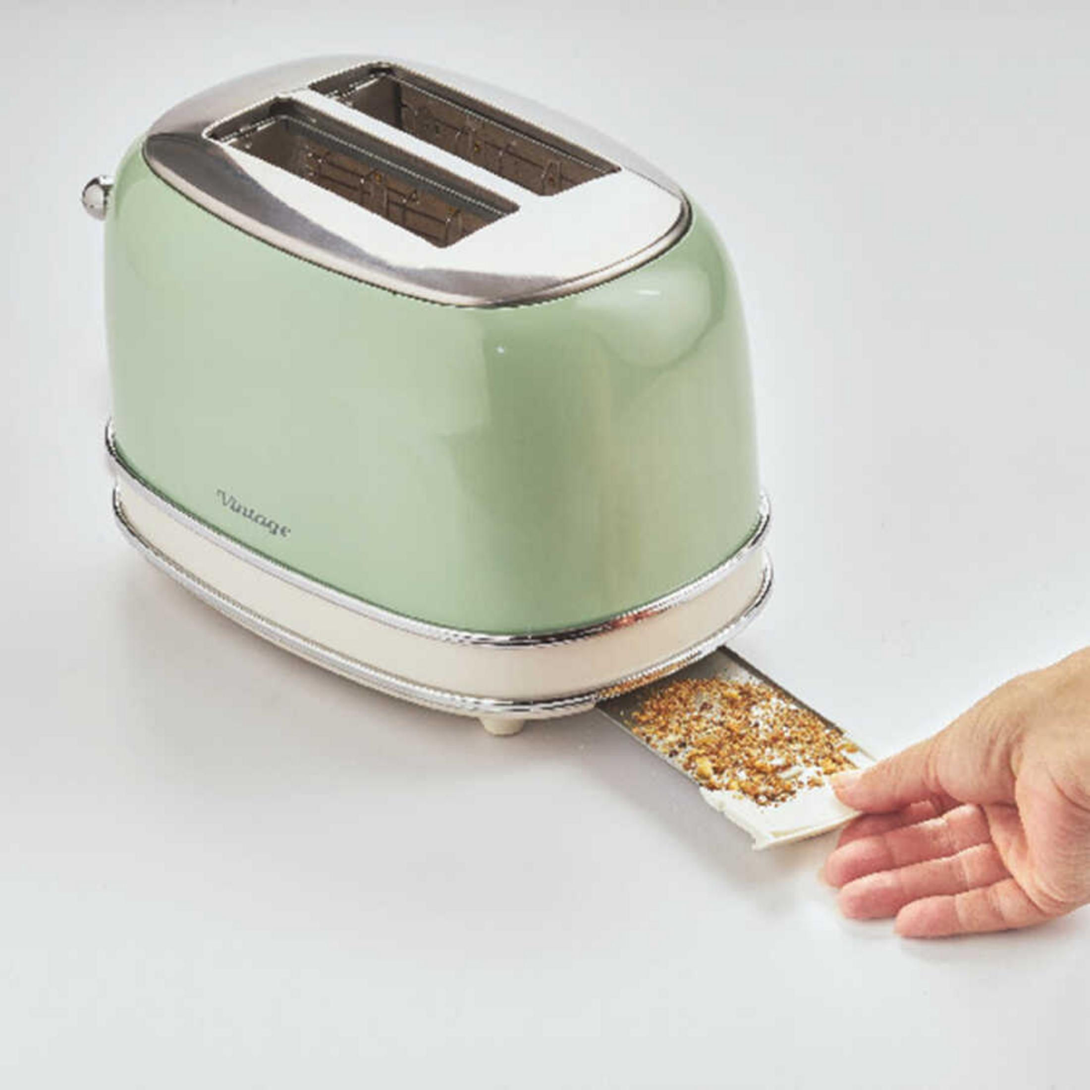 A green toaster with chrome details, crumb tray being pulled out.