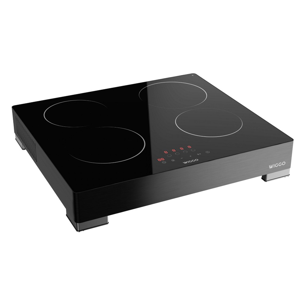Black induction cooktop with four cooking zones and a digital display.