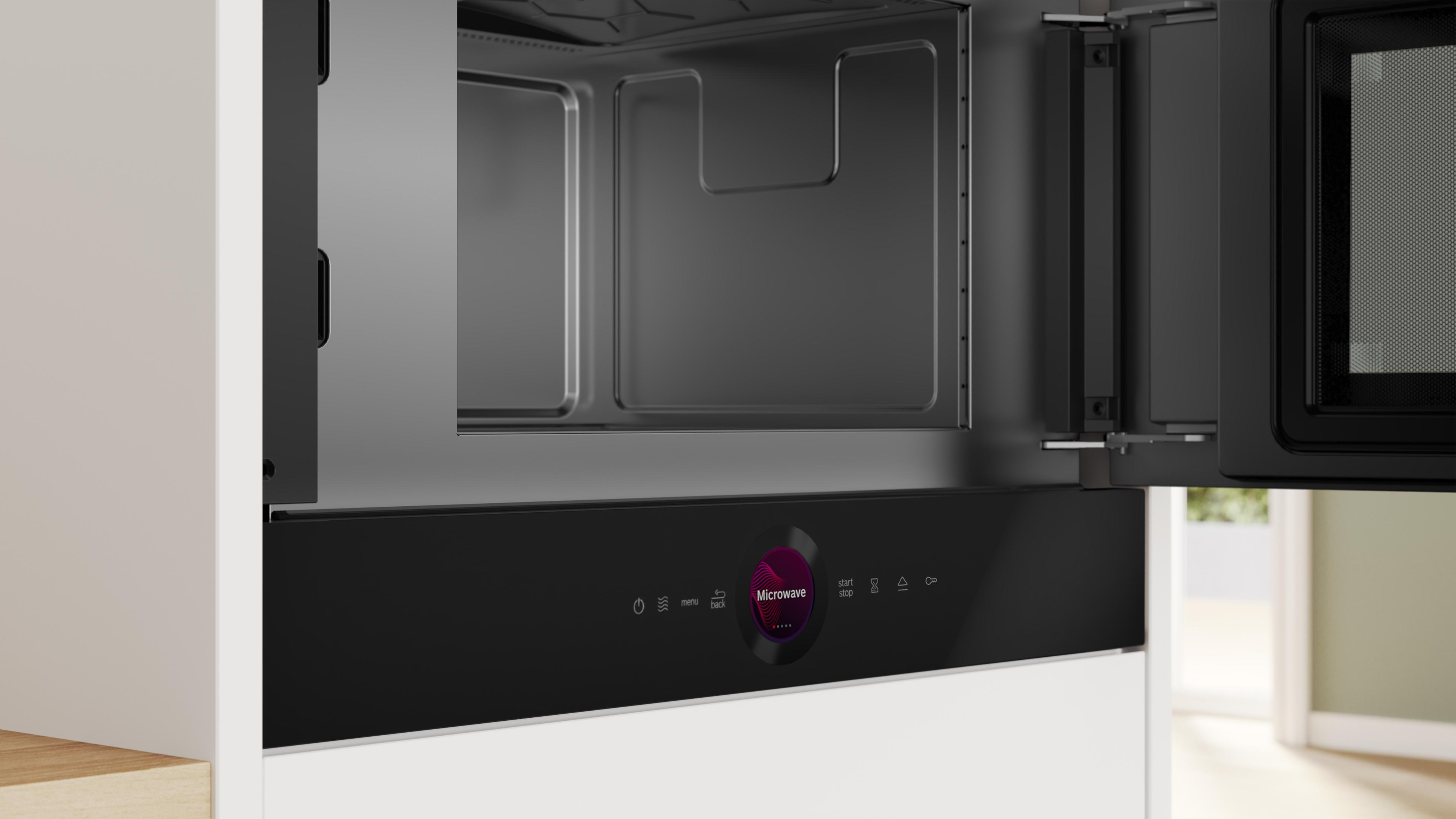 Nowoczesna kuchenka mikrofalowa wolnostojąca z otwartymi drzwiami i panelem cyfrowym.