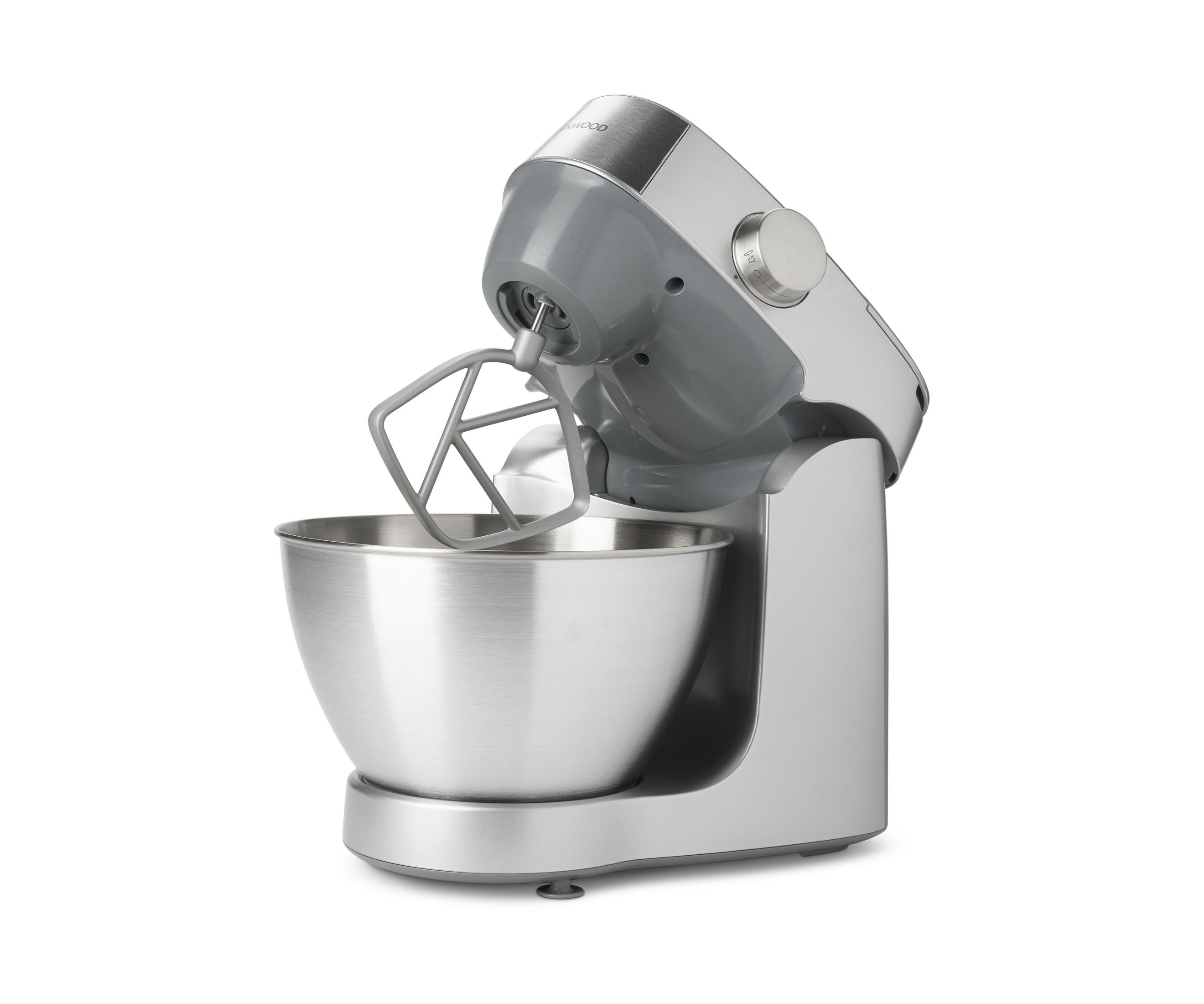 Ein silberner und grauer Küchenmixer mit Edelstahlschüssel und Rührbesen.