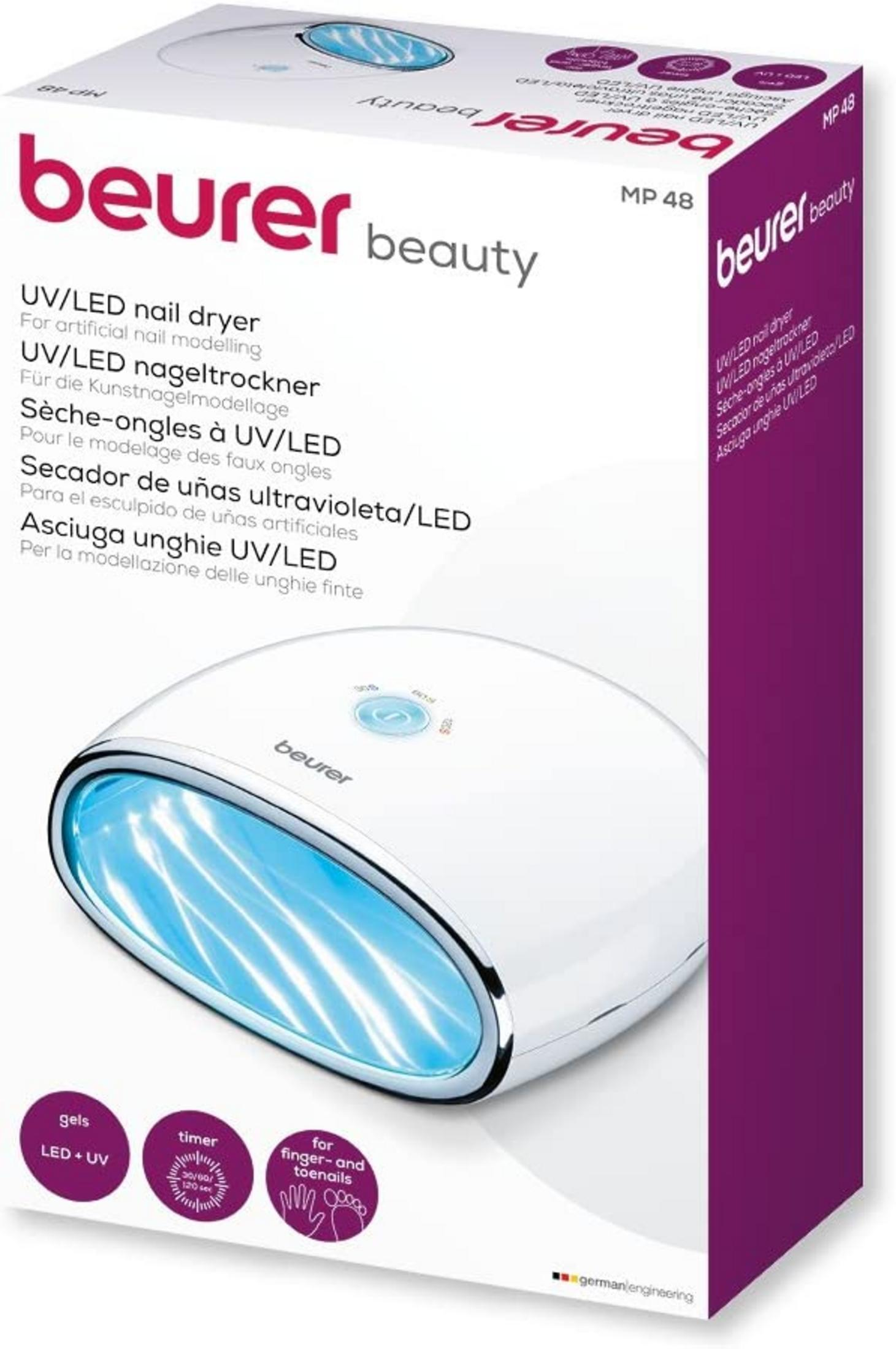 Weiße UV/LED-Nageltrockner-Box mit blauem Licht im Inneren und Produktinformationen.