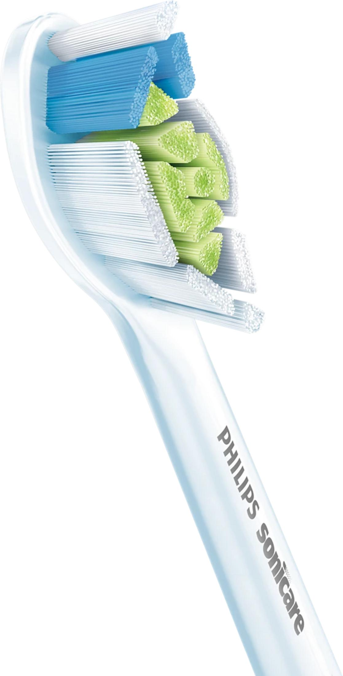 Primer plano de un cabezal de cepillo de dientes eléctrico con cerdas azules, blancas y verdes.