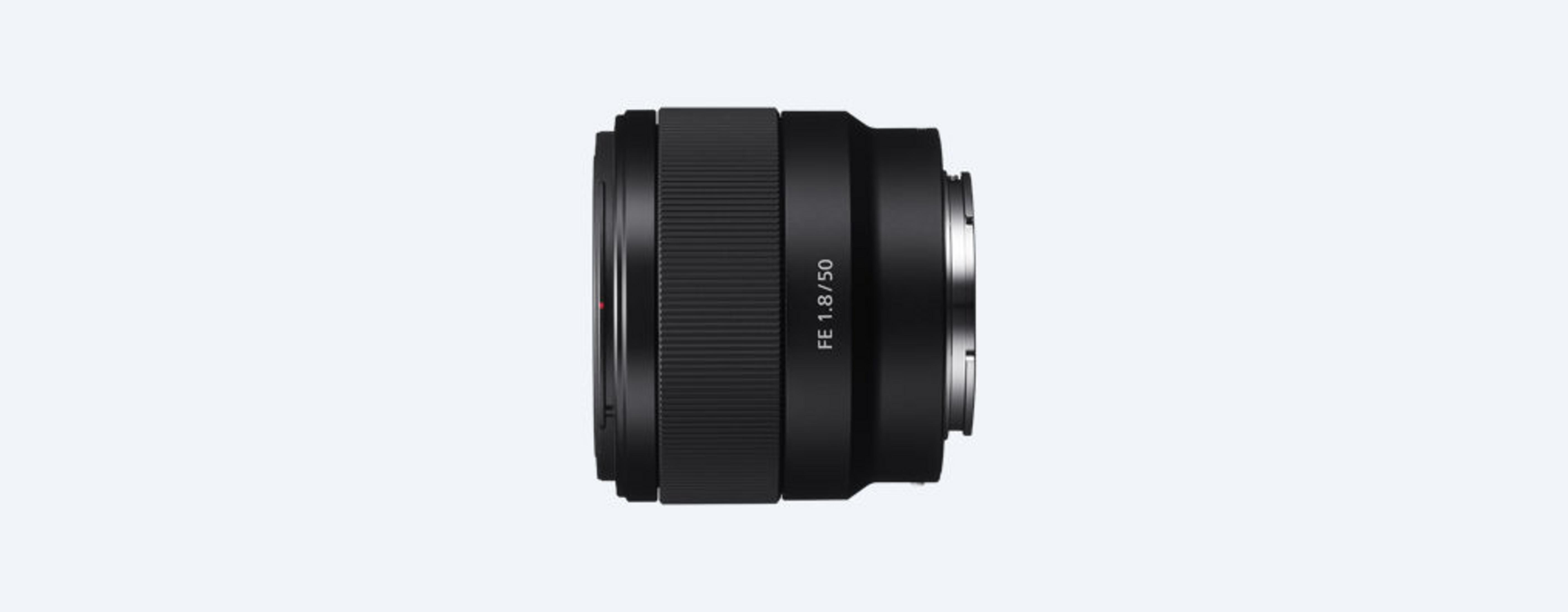 A black camera lens with the text FE 1.8/50.