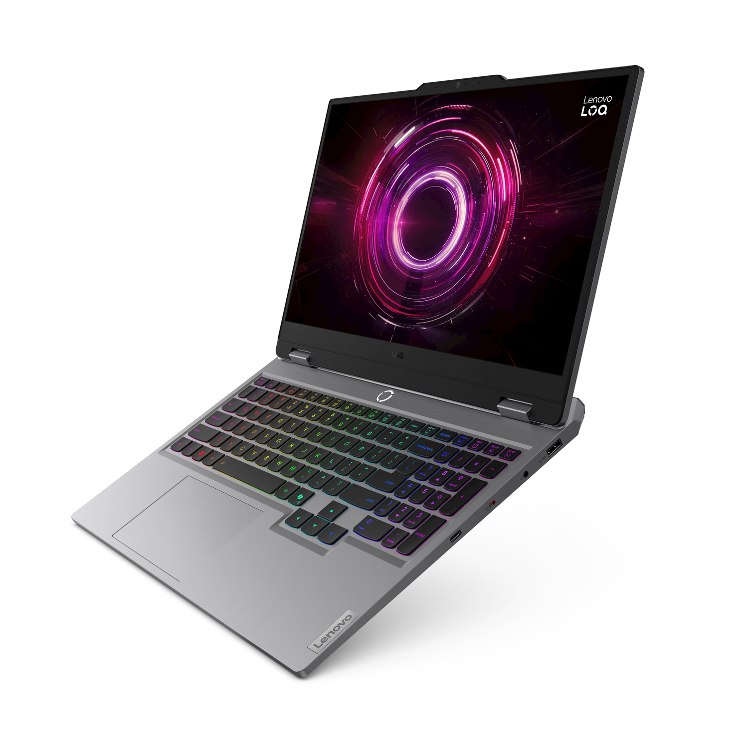 Un laptop argentato con tastiera illuminata colorata e salvaschermo dinamico.