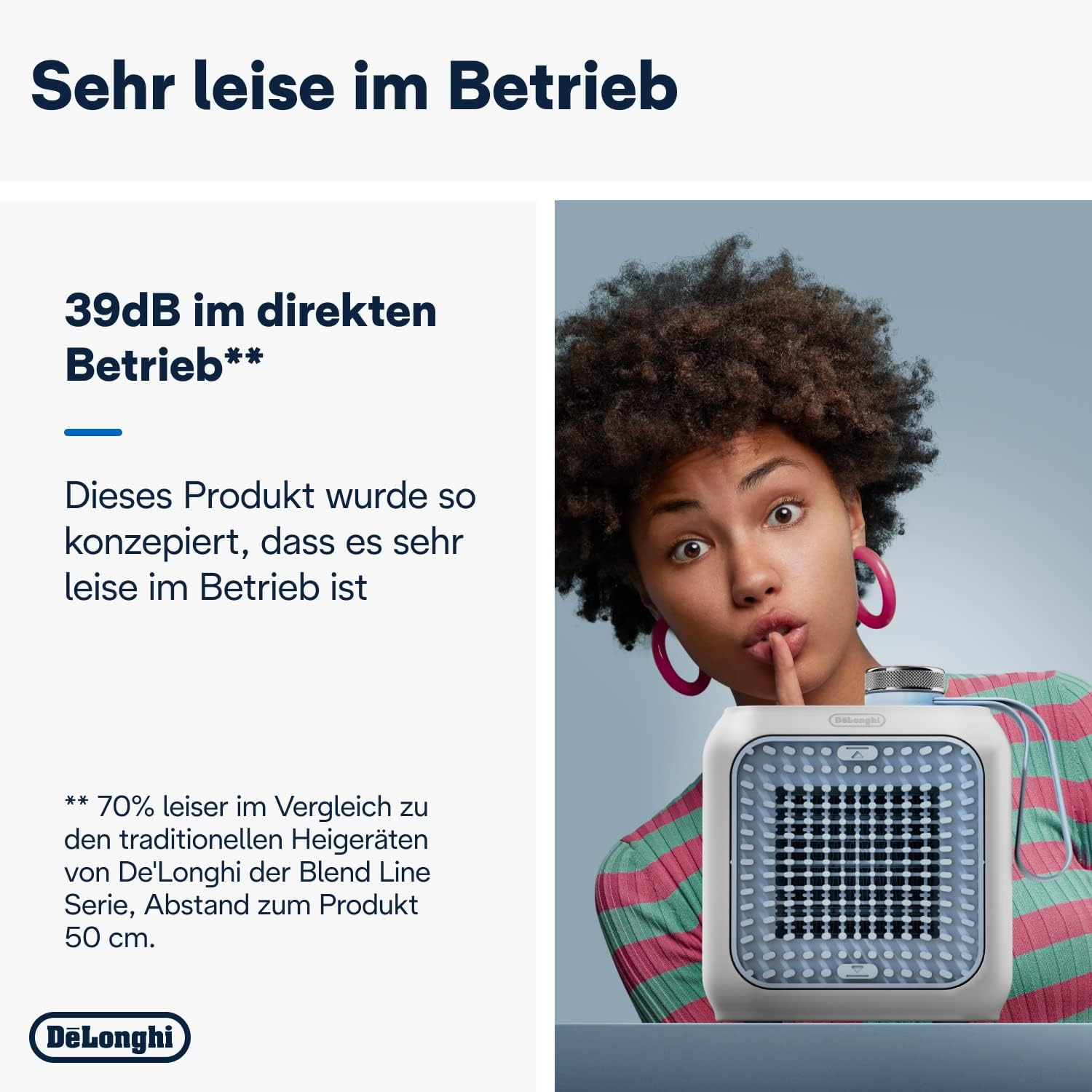 Kobieta z palcem na ustach obok białego grzejnika DeLonghi z niebieską kratką.