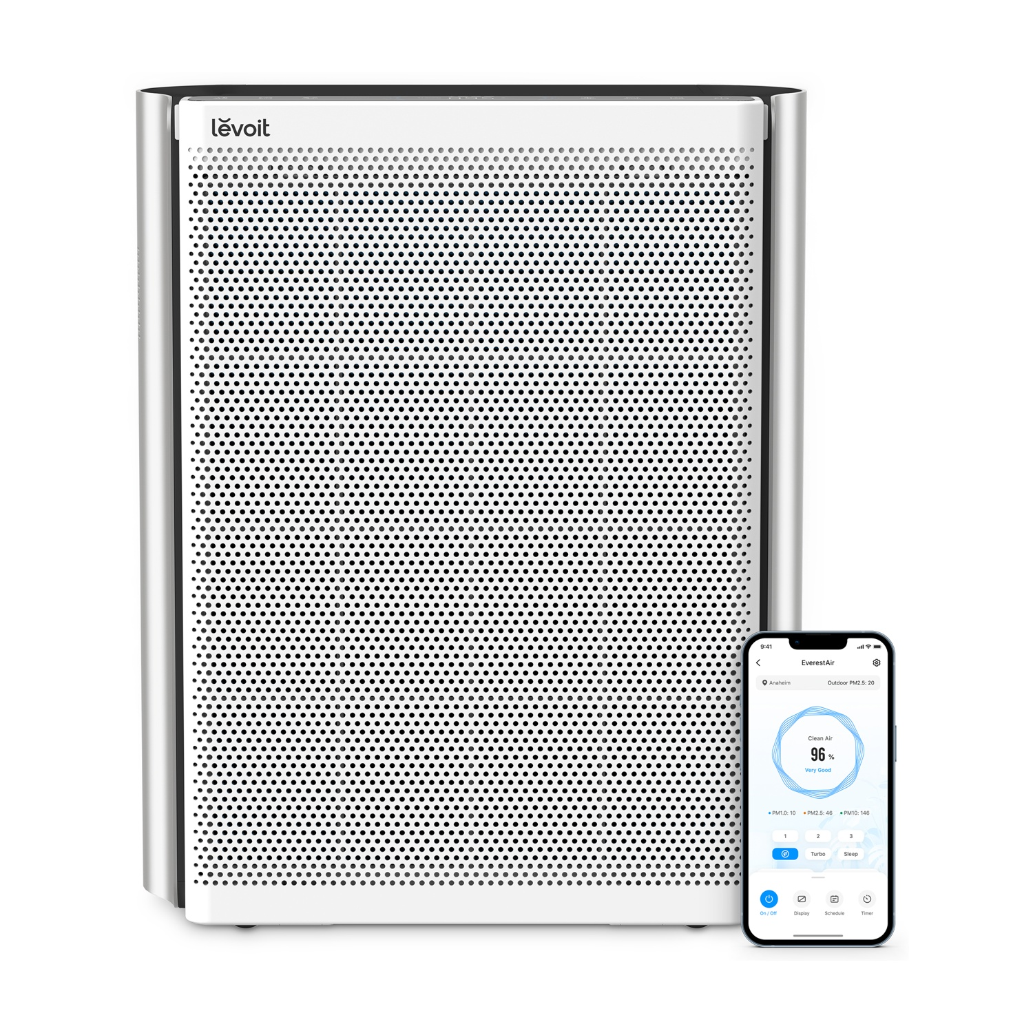 A white Levoit air purifier is next to a smartphone displaying an air quality app.
