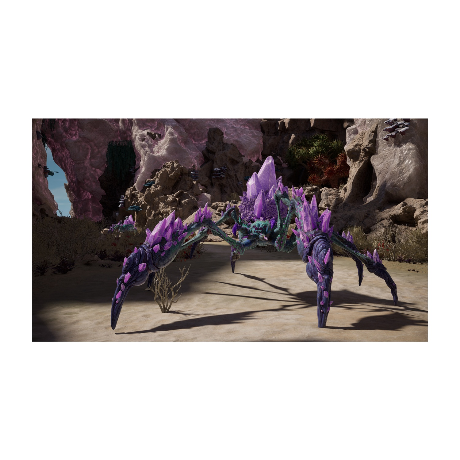 Una creatura ragno cristallina viola si trova in una grotta con pavimento sabbioso.