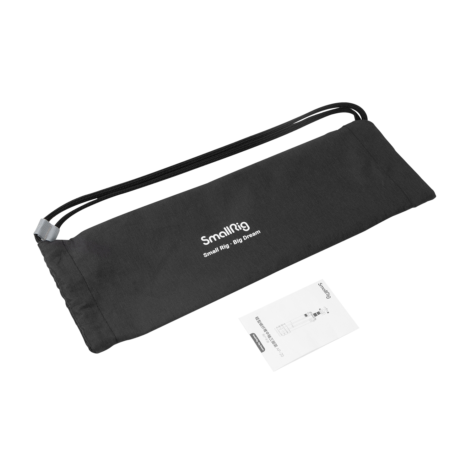 A black drawstring bag and a manual lie on a white background.
