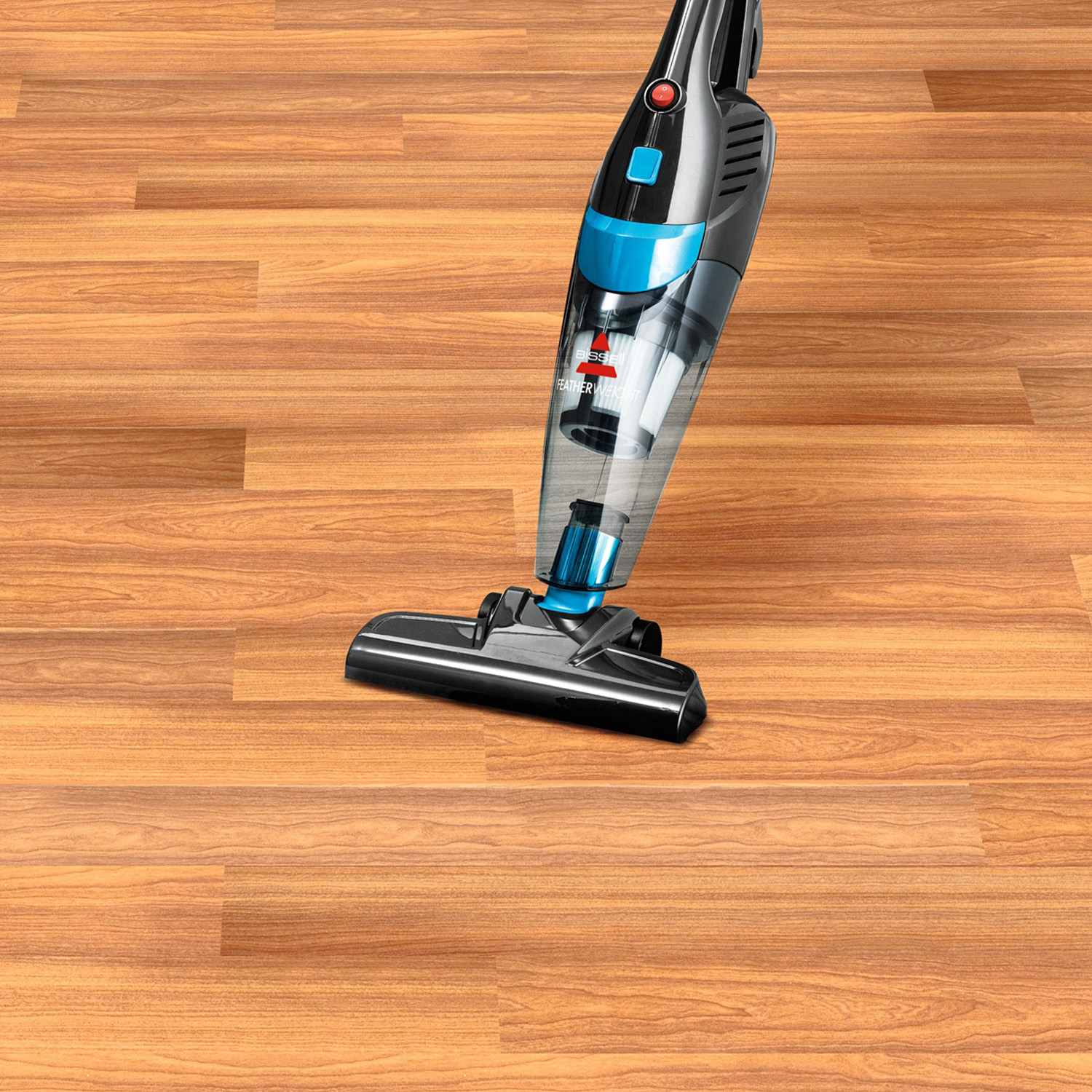 Ein kabelloser Staubsauger mit blau-schwarzem Gehäuse auf einem Holzboden.