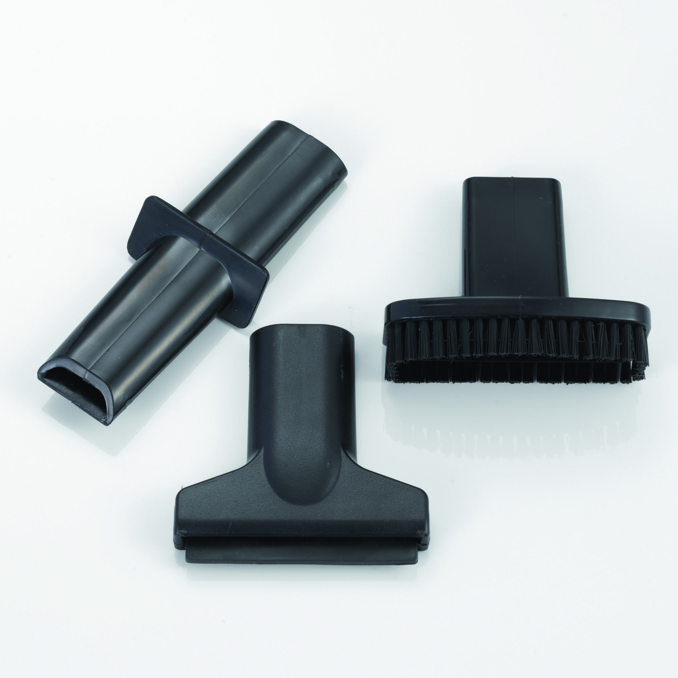 Three black vacuum cleaner attachments on a white background.