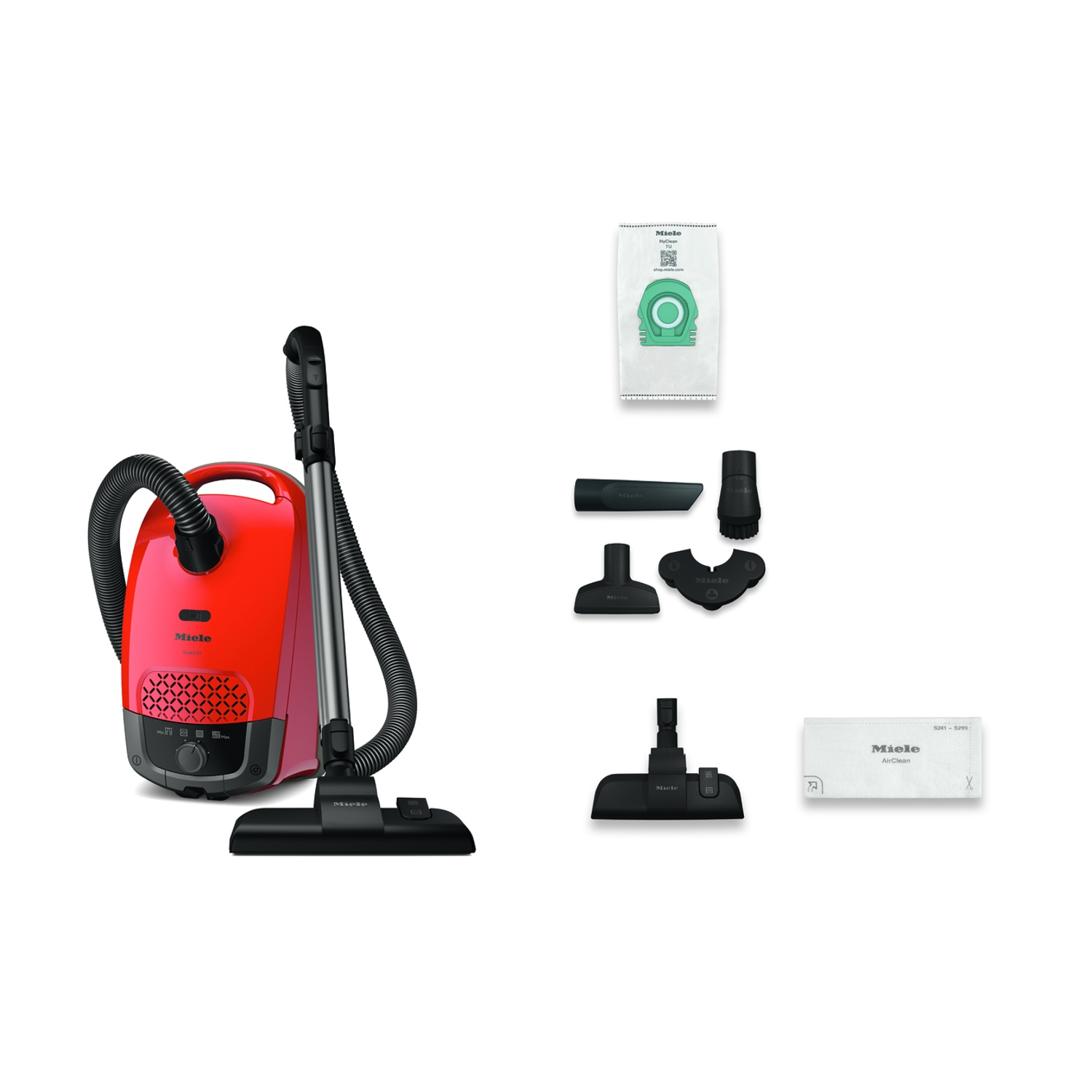 Ein roter Miele Staubsauger mit Zubehör: Staubbeutel, Bürsten und Filter.