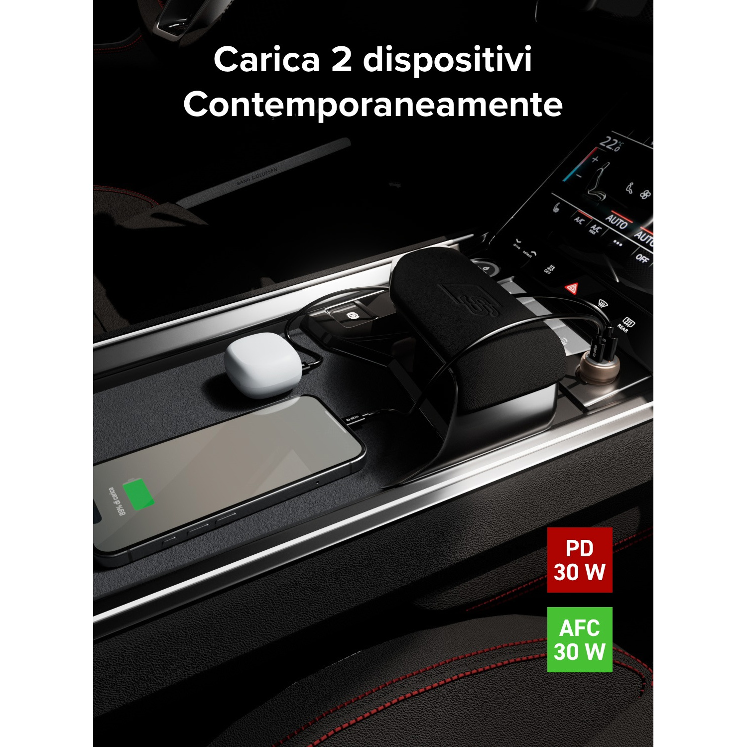 Un cargador de coche con un teléfono, auriculares y cables.