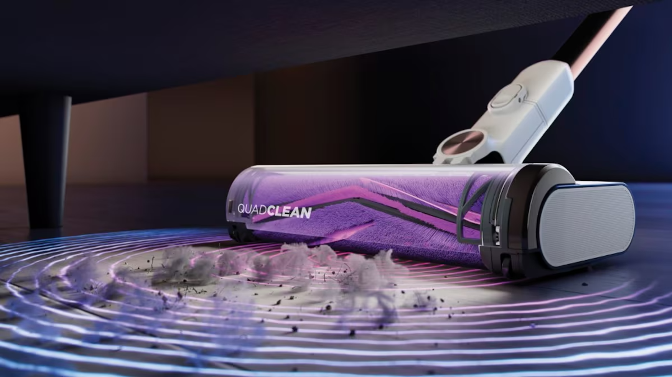 A vacuum cleaner with a purple brush roll cleans dirt on a wooden floor.