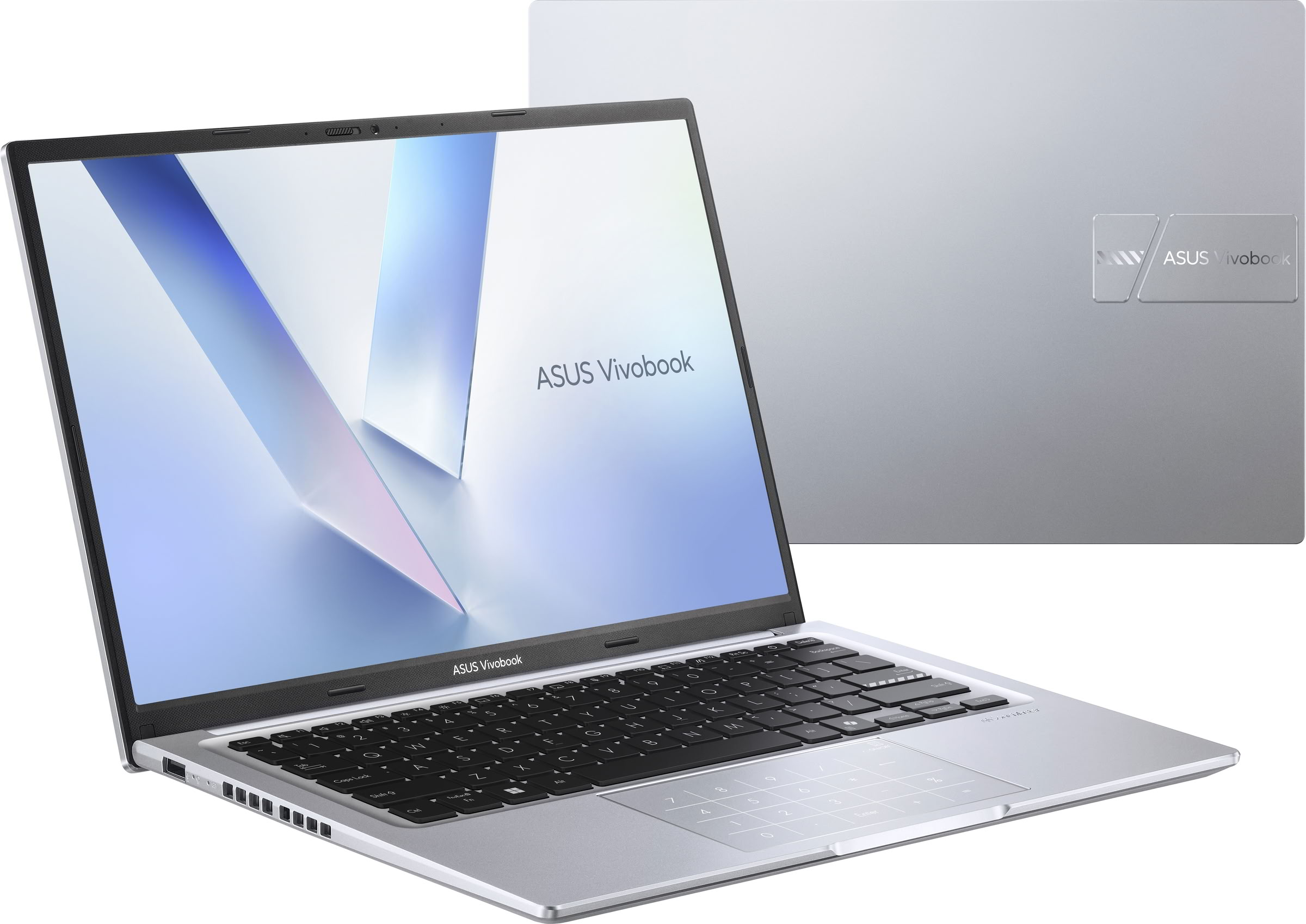 Un portátil plateado ASUS Vivobook está abierto. El teclado y el panel táctil son visibles.