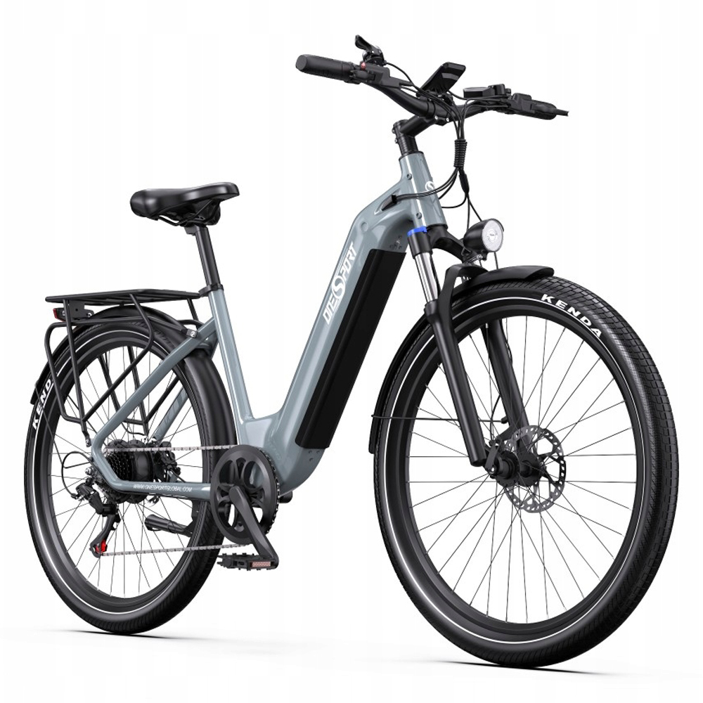 Bicicleta eléctrica gris para mujer con portaequipajes, neumáticos anchos y faro delantero.