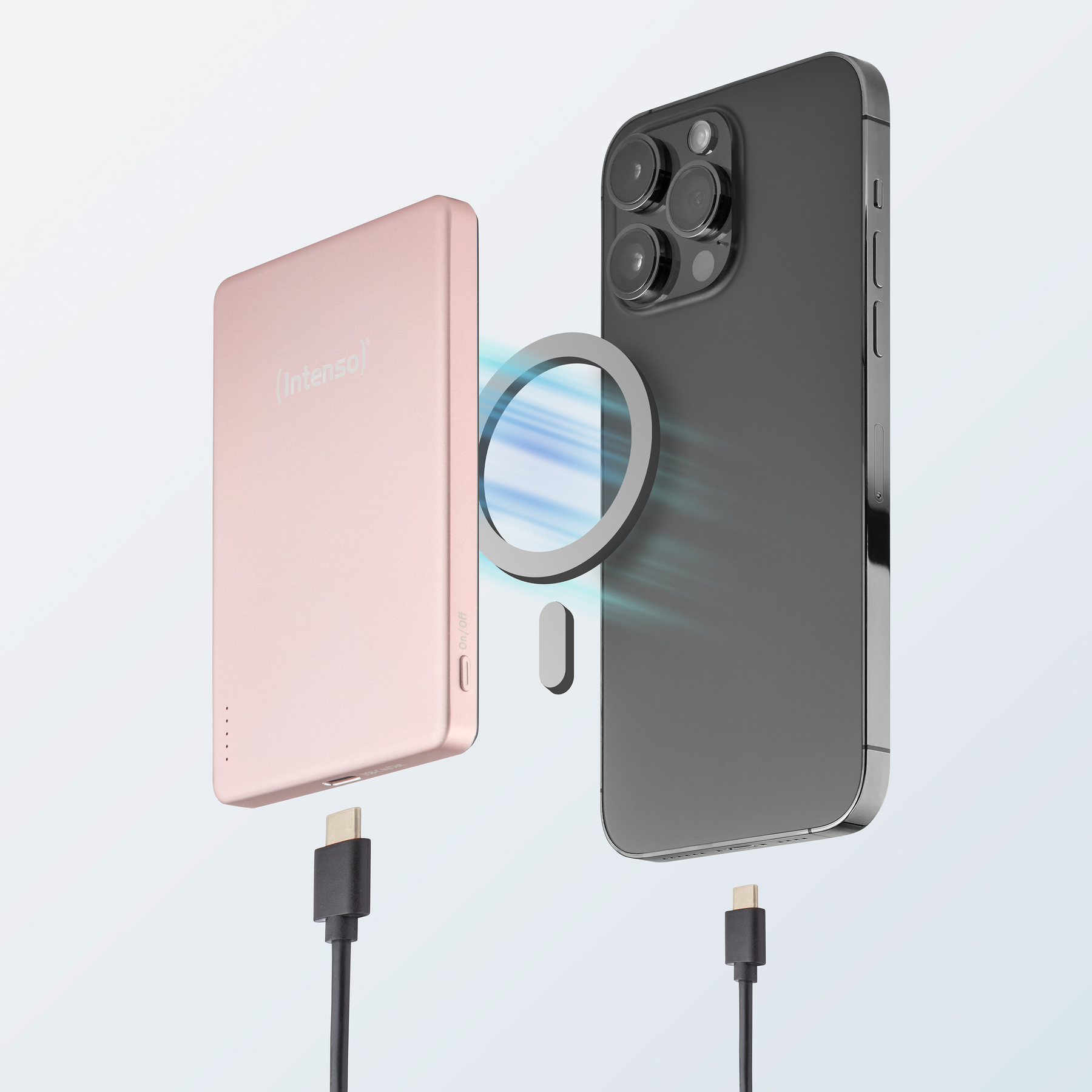 Ein rosafarbenes Powerbank-Gerät mit einem Ring und einem schwarzen Smartphone.