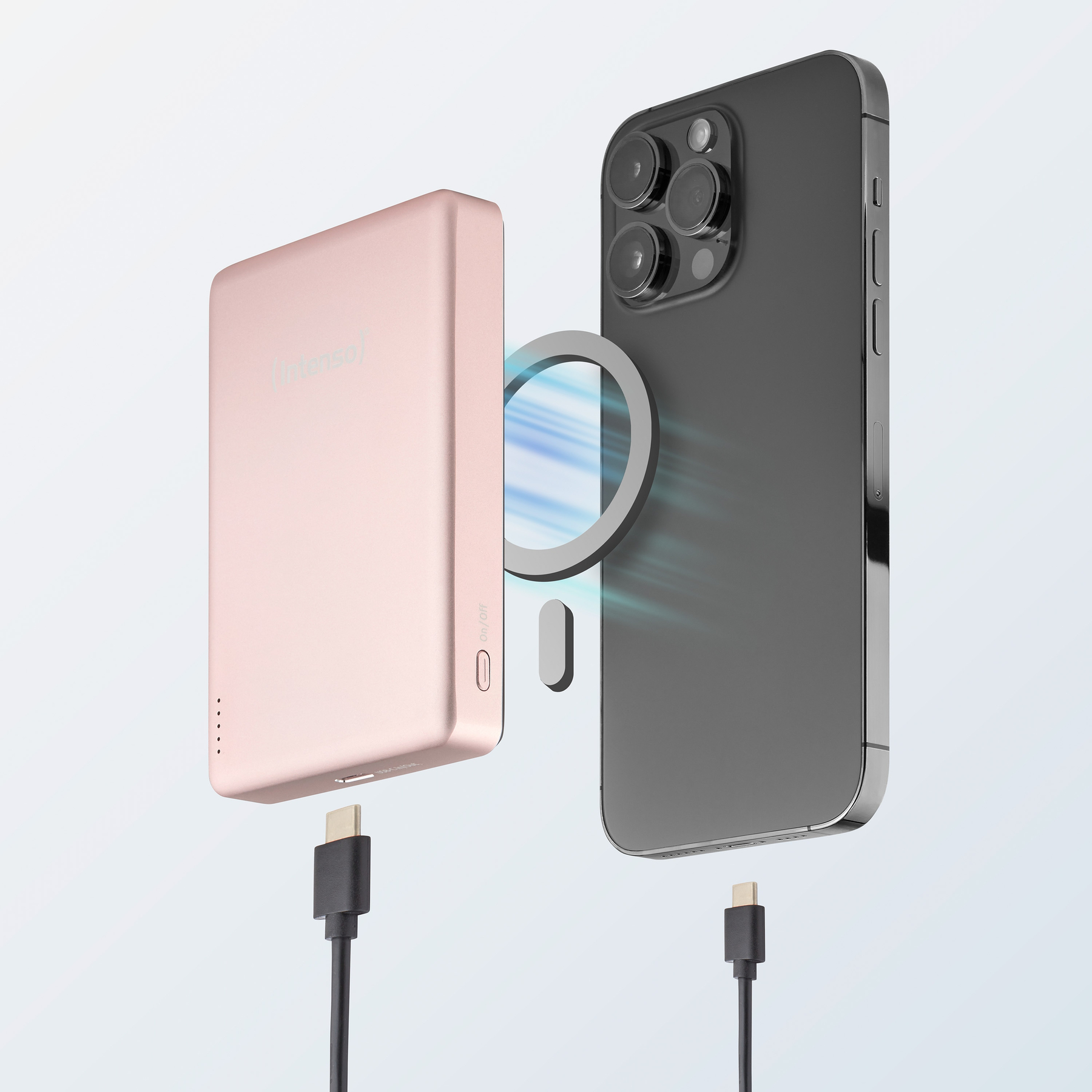 Ein rosafarbenes Powerbank lädt ein schwarzes Smartphone per USB-C.