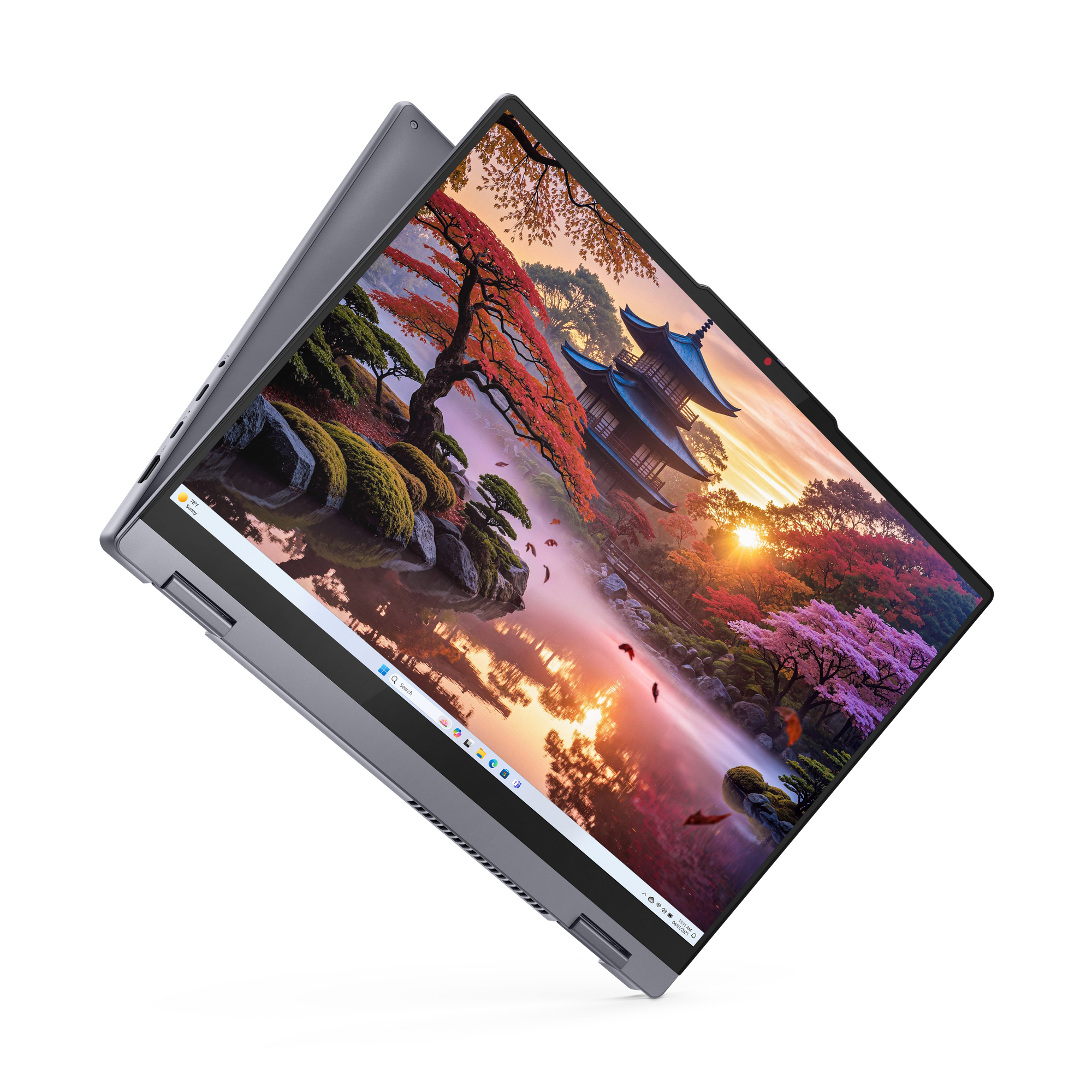 Laptop wyświetla obraz japońskiego ogrodu z pagodami i jesiennymi drzewami.